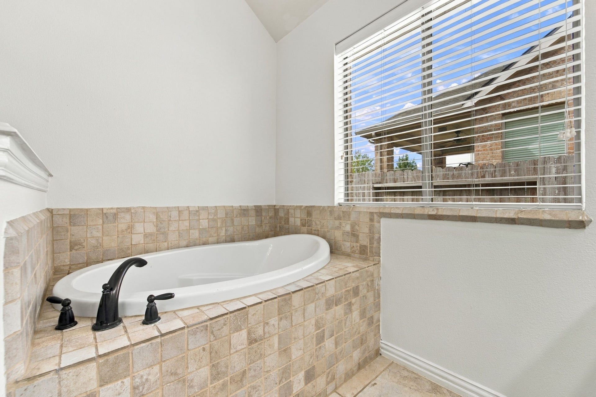 19011 Crest Cove Drive, Cypress, TX 77433 Primary bath soaking tub, ready for a relaxing end to the day.