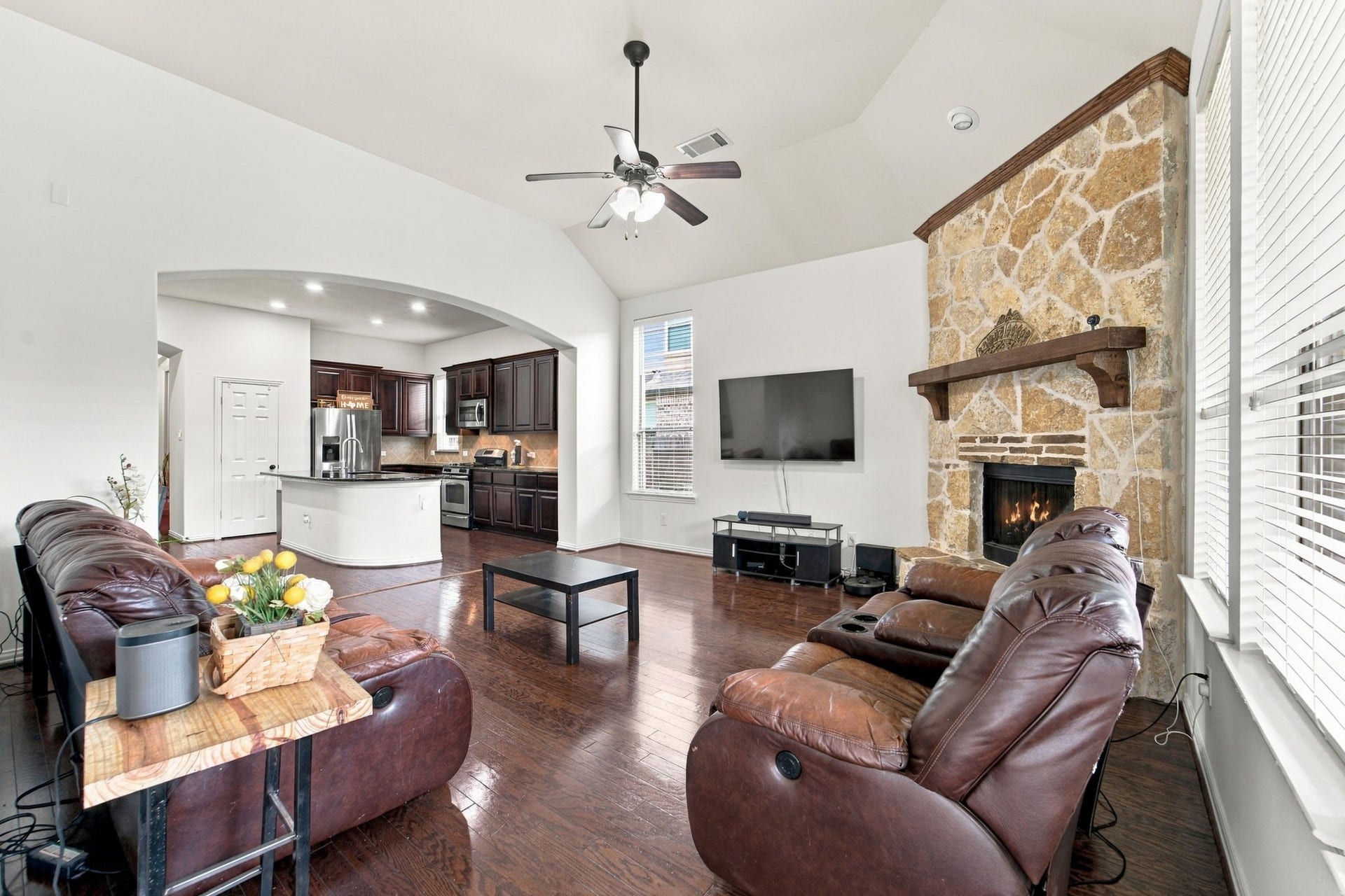 19011 Crest Cove Drive, Cypress, TX 77433 Seamless connectivity between the living room and kitchen keeps the layout open and easy to enjoy.