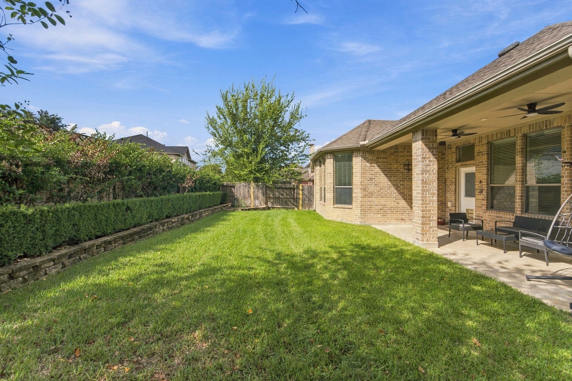 19011 Crest Cove Drive, Cypress, TX 77433 Room to play, garden, or relax in this backyard, with a refreshed back fence for added privacy.