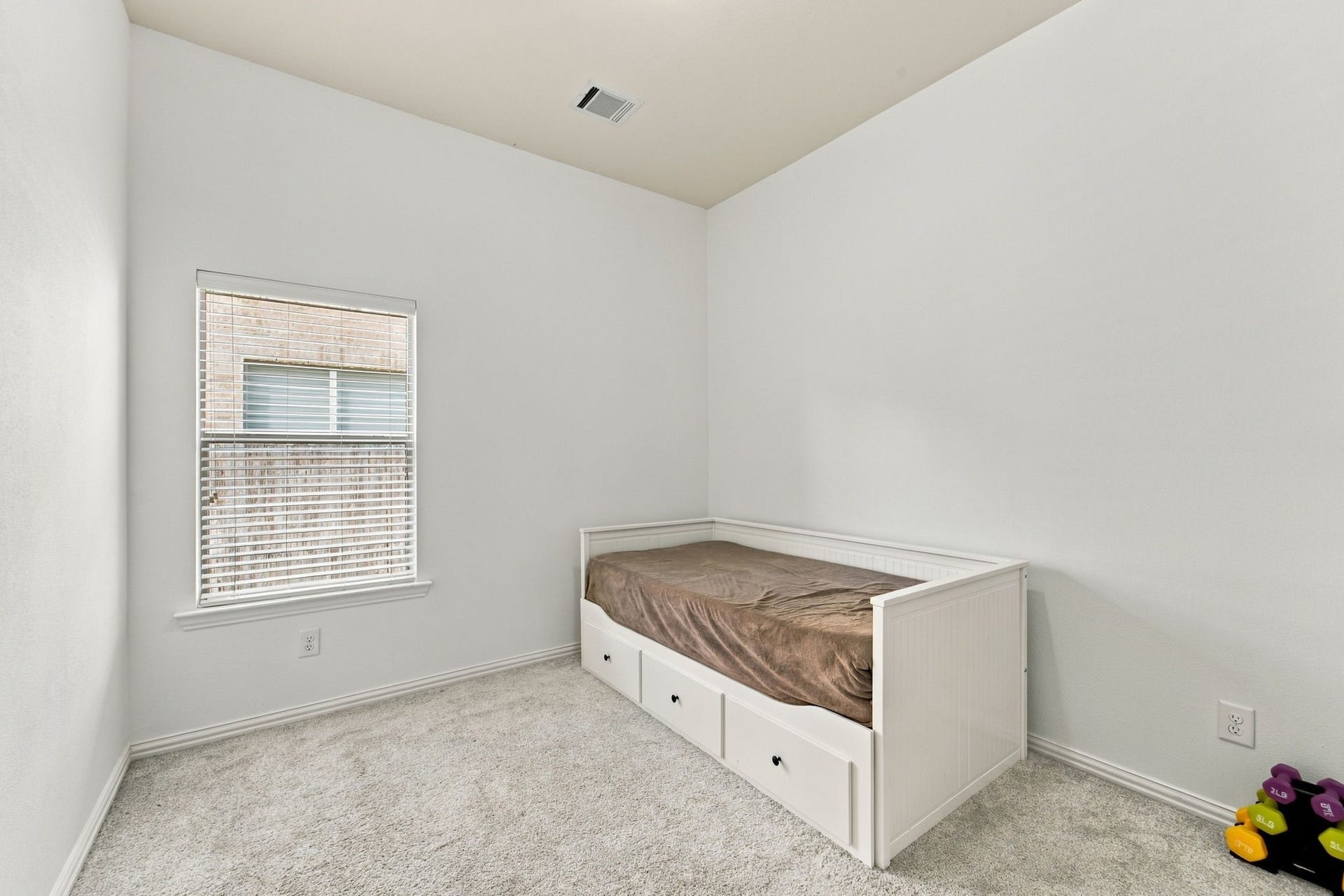 19011 Crest Cove Drive, Cypress, TX 77433 A comfortable secondary bedroom with soft carpet and a bright window, ready for guests, kids, or a hobby space.