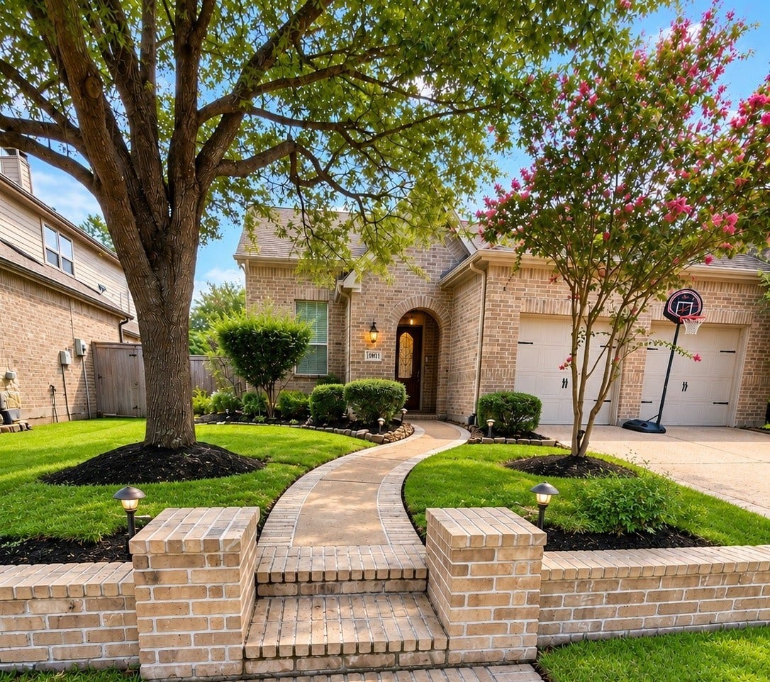 19011 Crest Cove Drive, Cypress, TX 77433 A warm welcome starts right here! Tree-lined streets, open green space, and a well-kept front yard come together.