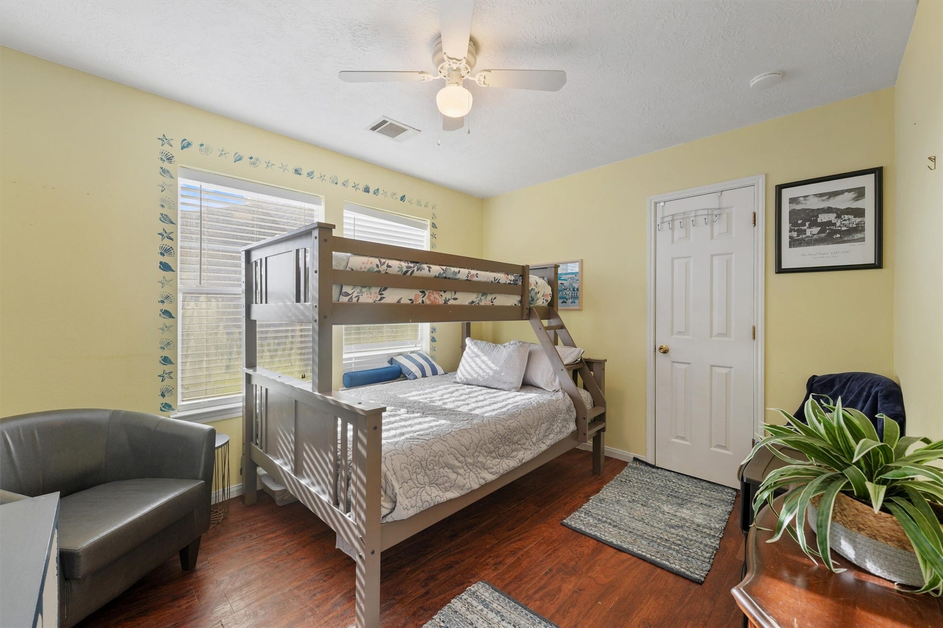 22513 Bay Point Drive, Galveston, TX 77554 Secondary bedroom features large windows, custom paint, and beautiful floors.