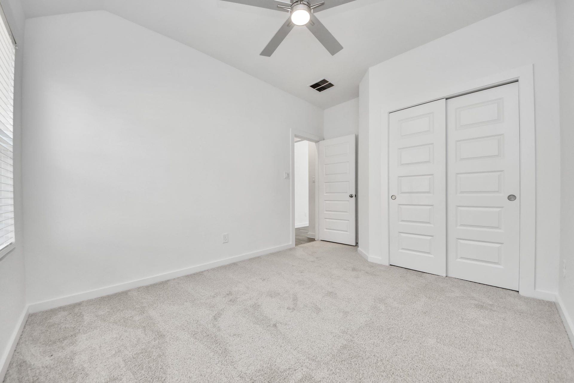 5830 Madison Trail Drive, Richmond, TX 77469 Generously sized secondary bedrooms featuring spacious closets, soft and inviting carpeting underfoot, large windows allowing plenty of natural light, and the added touch of privacy blinds for your personal retreat. Sample photo of completed home with similar floor plan. Actual colors and selections may vary.