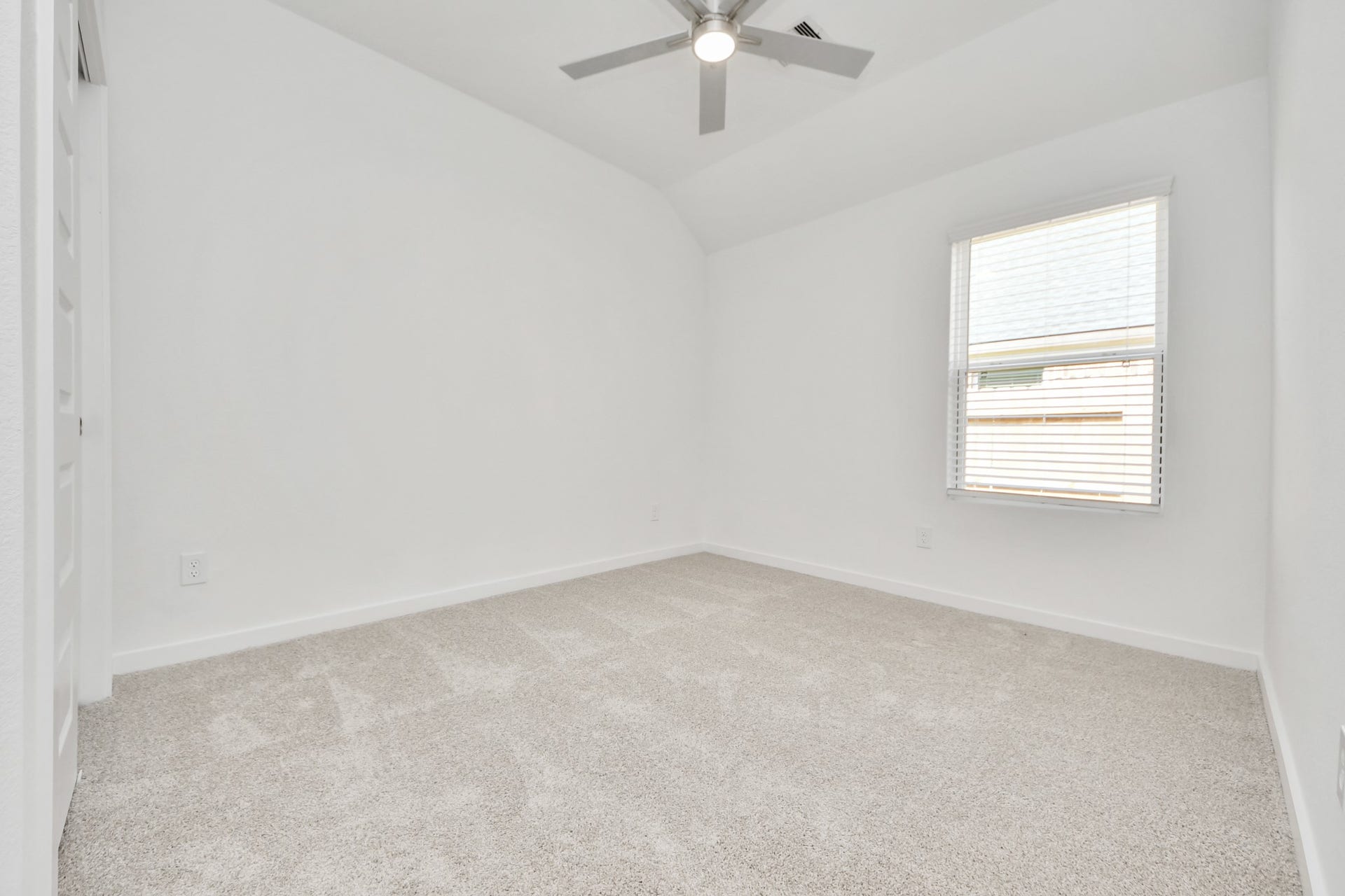 5830 Madison Trail Drive, Richmond, TX 77469 Secondary bedroom features plush carpeting, large windows that let in plenty of natural light, bright paint, and spacious closets. Sample photo of completed home with similar floor plan. Actual colors and selections may vary.