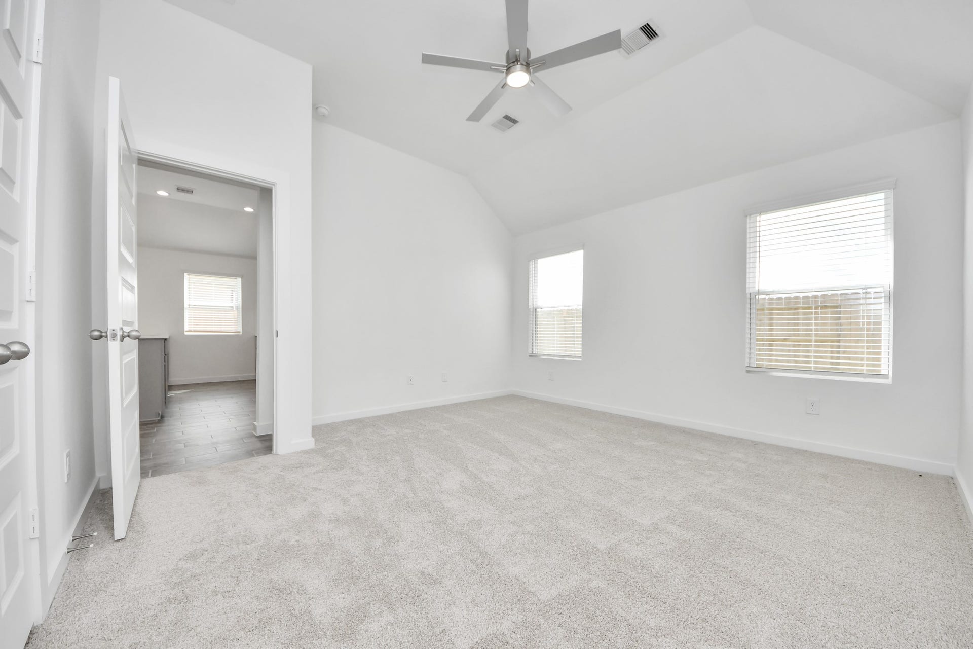 5830 Madison Trail Drive, Richmond, TX 77469 Come and unwind after a long day in this magnificent primary suite! This spacious room features plush carpet, warm paint, high ceilings and large windows with privacy blinds. v