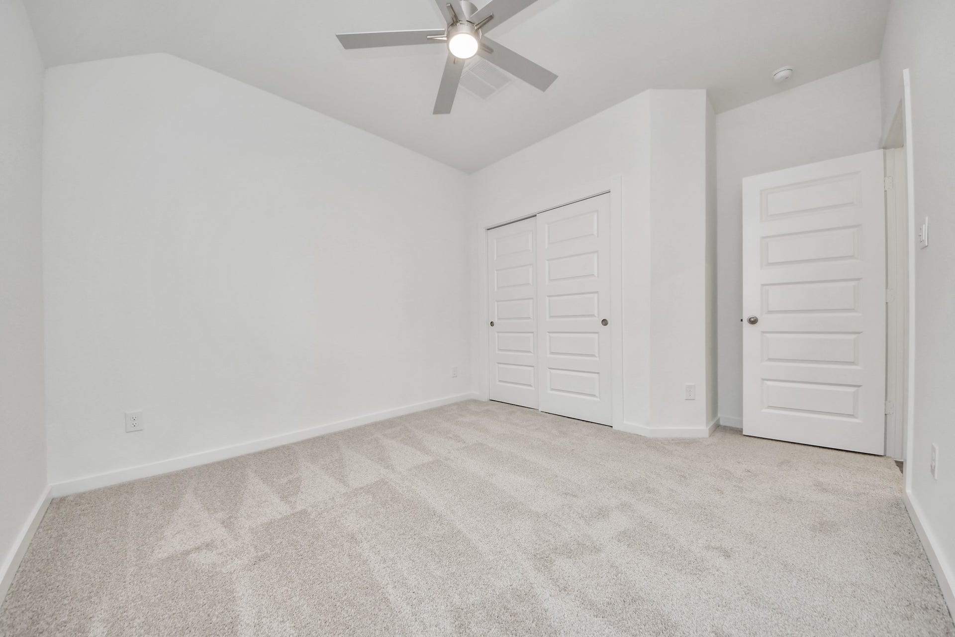 5830 Madison Trail Drive, Richmond, TX 77469 Generously sized secondary bedrooms featuring spacious closets, soft and inviting carpeting underfoot, large windows allowing plenty of natural light, and the added touch of privacy blinds for your personal retreat. Sample photo of completed home with similar floor plan. Actual colors and selections may vary.