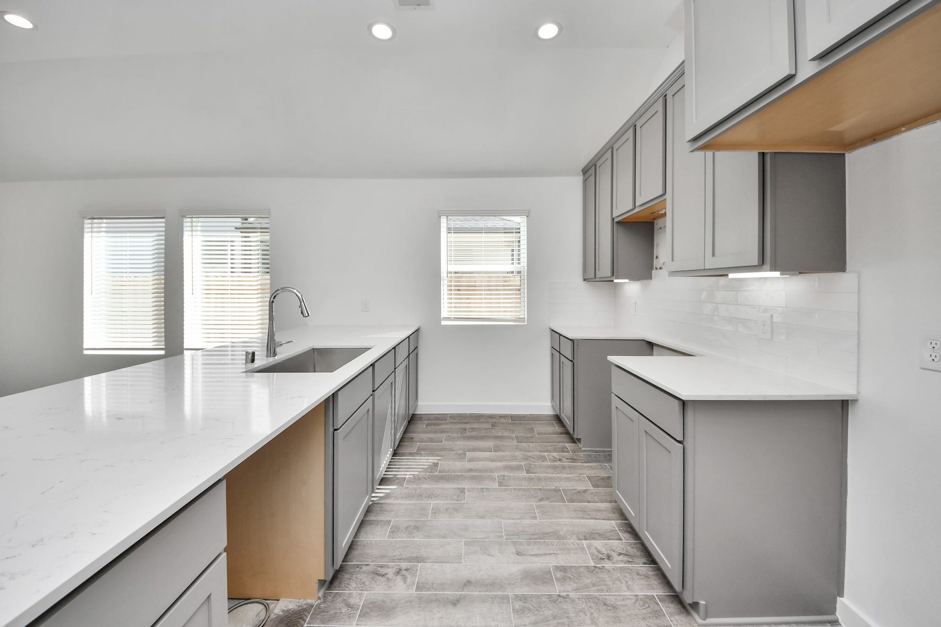 5830 Madison Trail Drive, Richmond, TX 77469 The extended counter area adds both practicality and style, making meal preparation a breeze. Every detail is thoughtfully designed to enhance the kitchen's functionality and aesthetic appeal. Sample photo of completed home with similar floor plan. Actual colors and selections may vary.