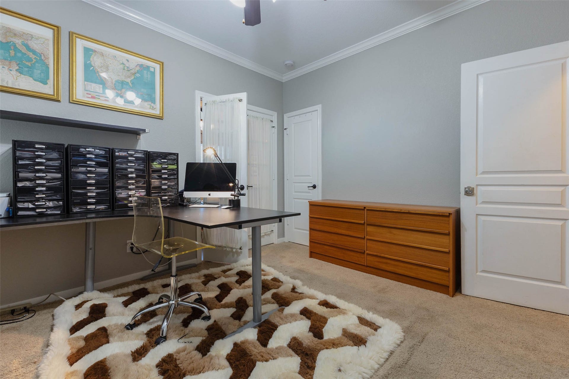 25734 Jewel Springs Lane, Katy, TX 77494 A versatile study with crown molding offers a polished setting for work or additional bedroom accommodations.