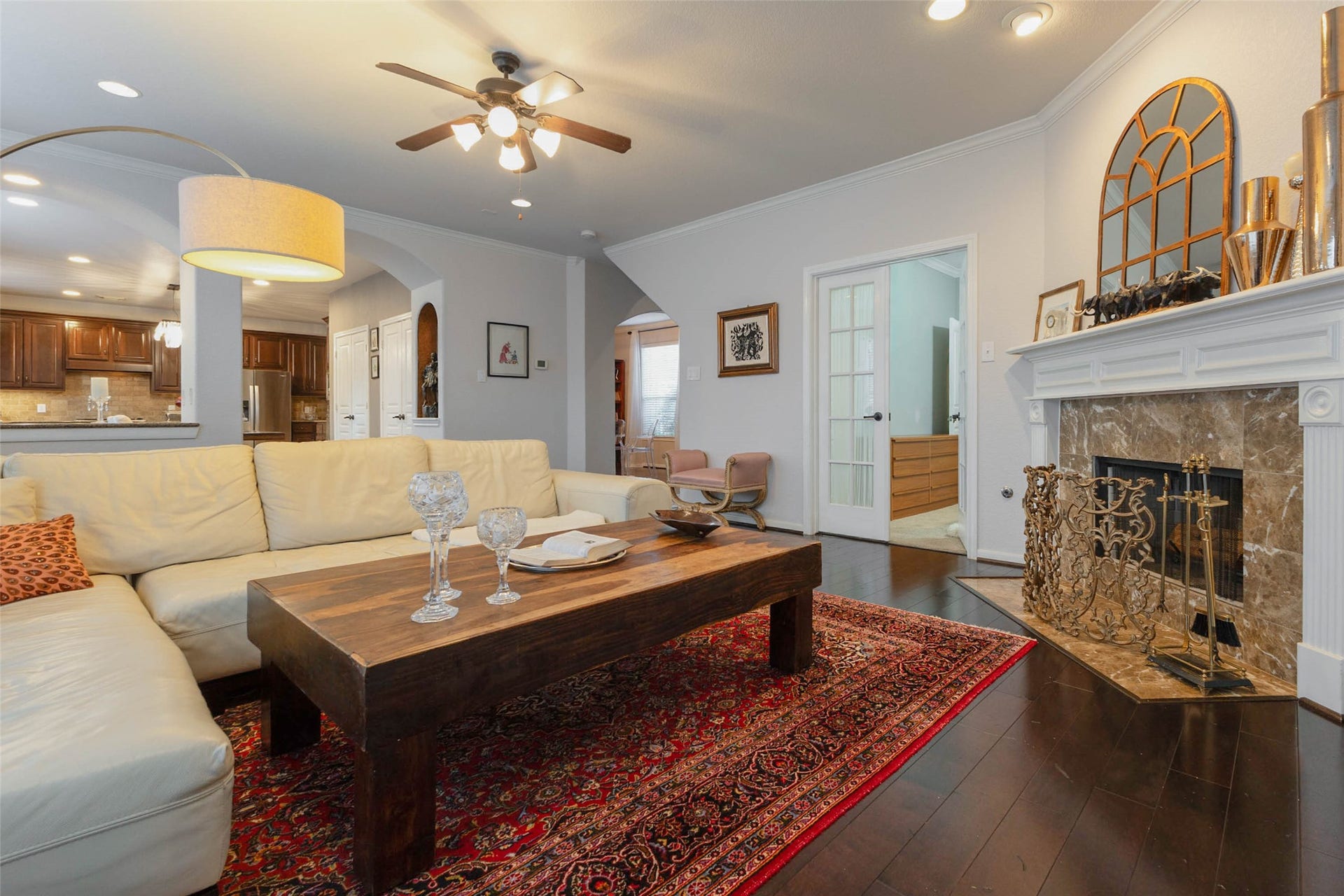 25734 Jewel Springs Lane, Katy, TX 77494 Arched openings provide a seamless transition from the family room to the kitchen with an effortless flow.