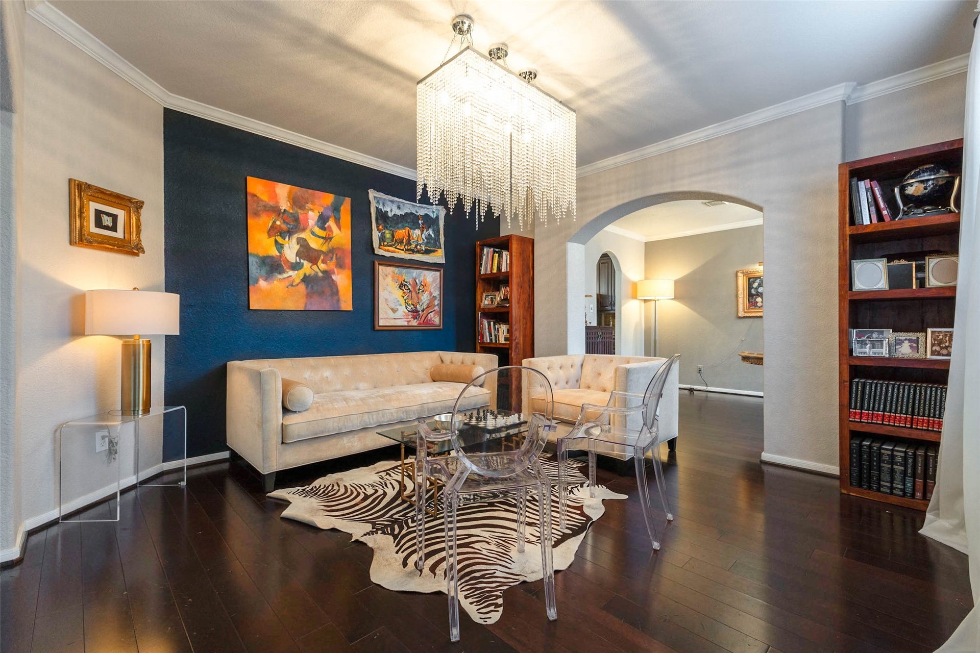 25734 Jewel Springs Lane, Katy, TX 77494 Contemporary lighting, refined archways & contrasting finishes give this formal living area a distinctive, gallery-inspired aesthetic.