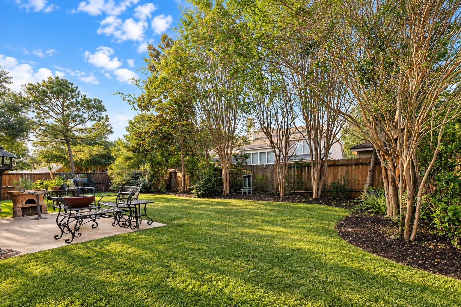 25734 Jewel Springs Lane, Katy, TX 77494 This inviting retreat offers a charming patio for outdoor dining and an expansive lawn.