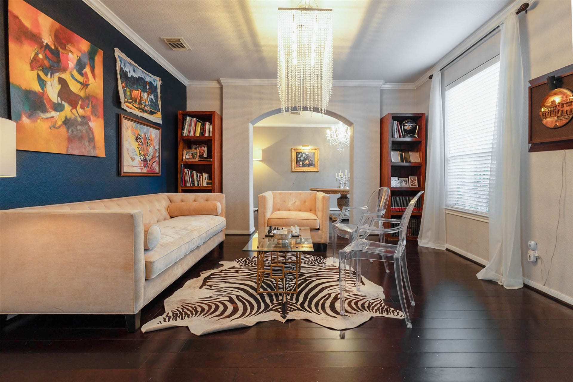 25734 Jewel Springs Lane, Katy, TX 77494 A dramatic navy accent wall, rich hardwood flooring create a sophisticated space with unmistakable personality.
