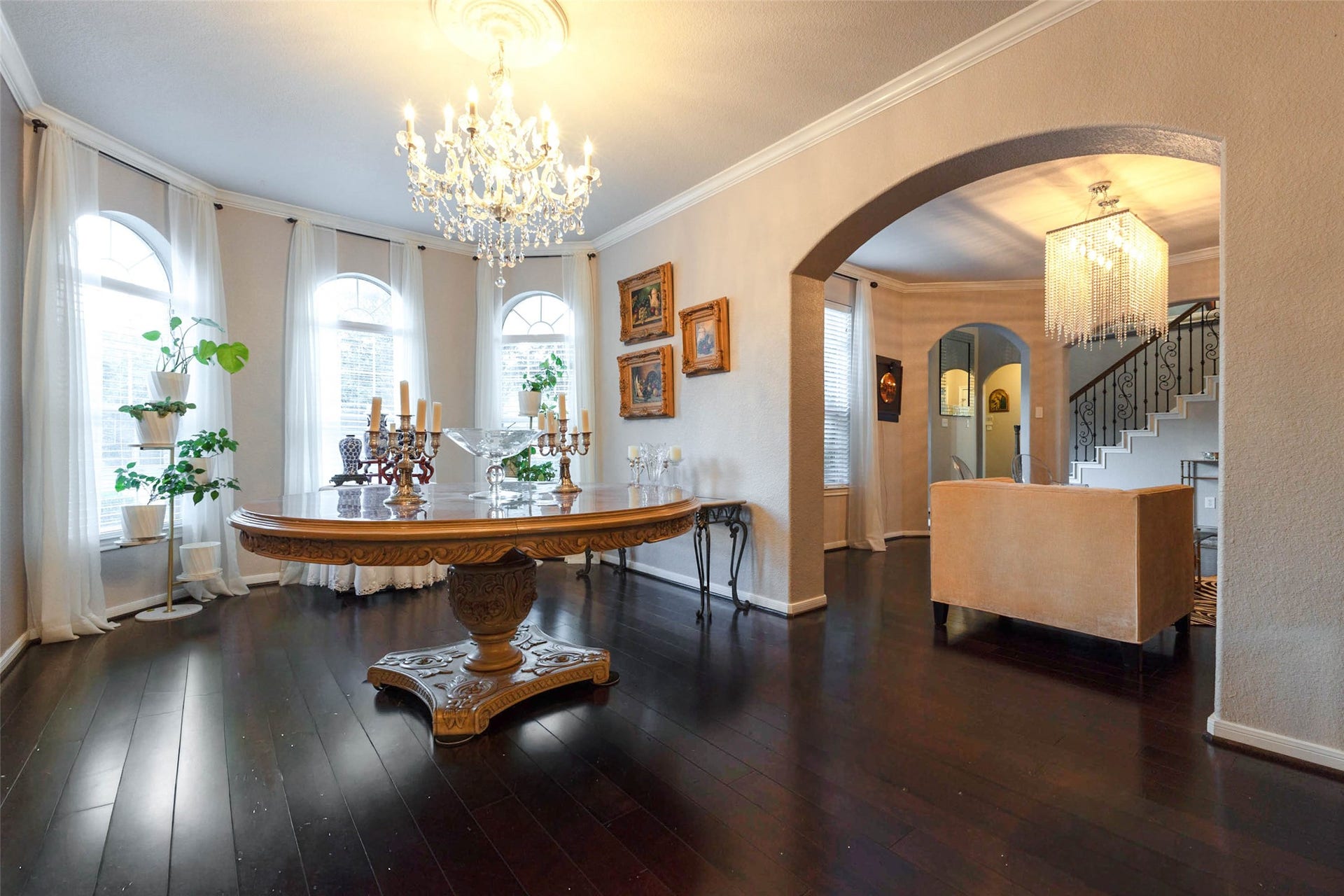 25734 Jewel Springs Lane, Katy, TX 77494 A wall of gracefully arched windows accents an elegant backdrop for entertaining.