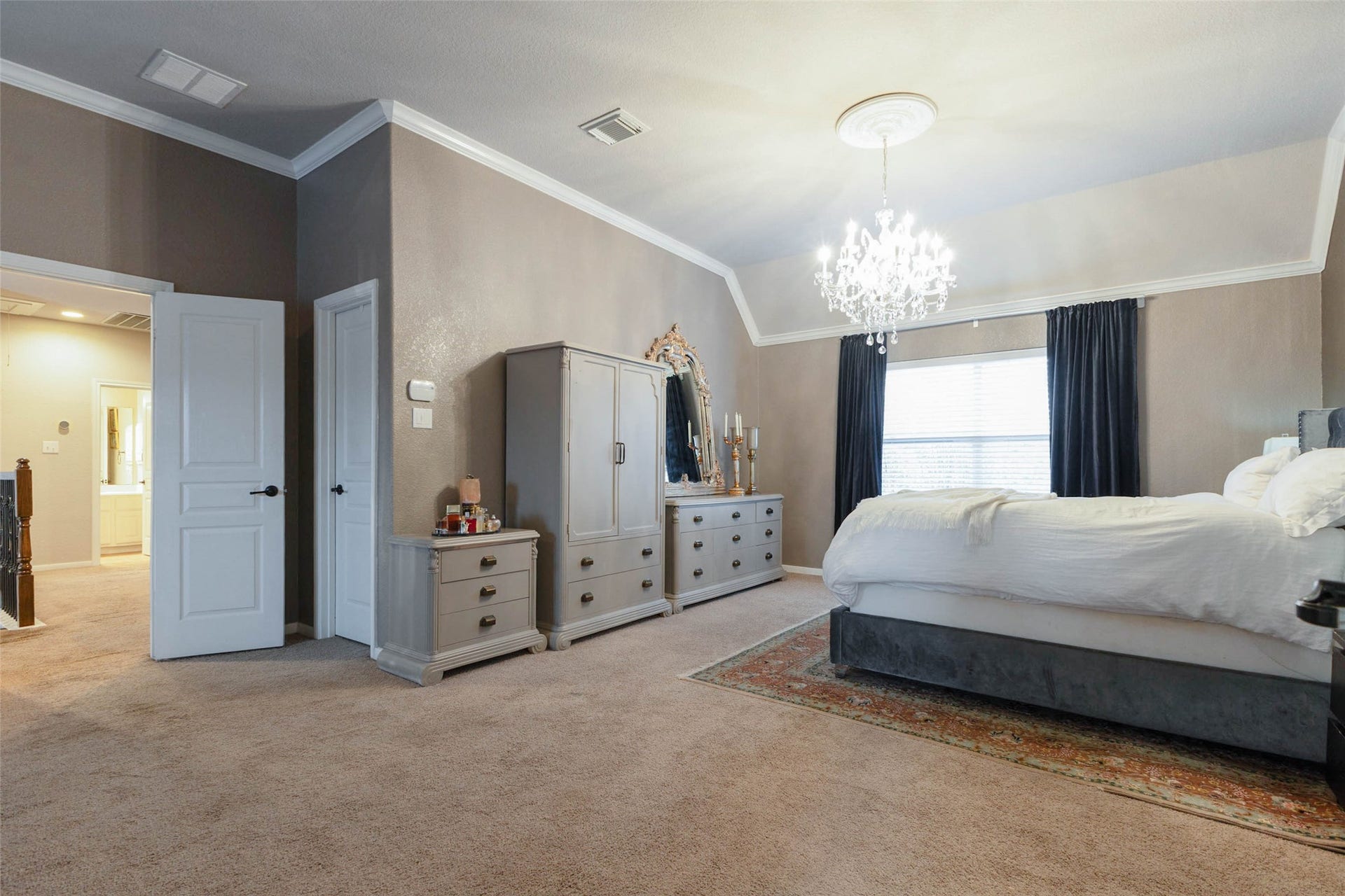 25734 Jewel Springs Lane, Katy, TX 77494 This expansive second-story primary suite exudes timeless elegance.