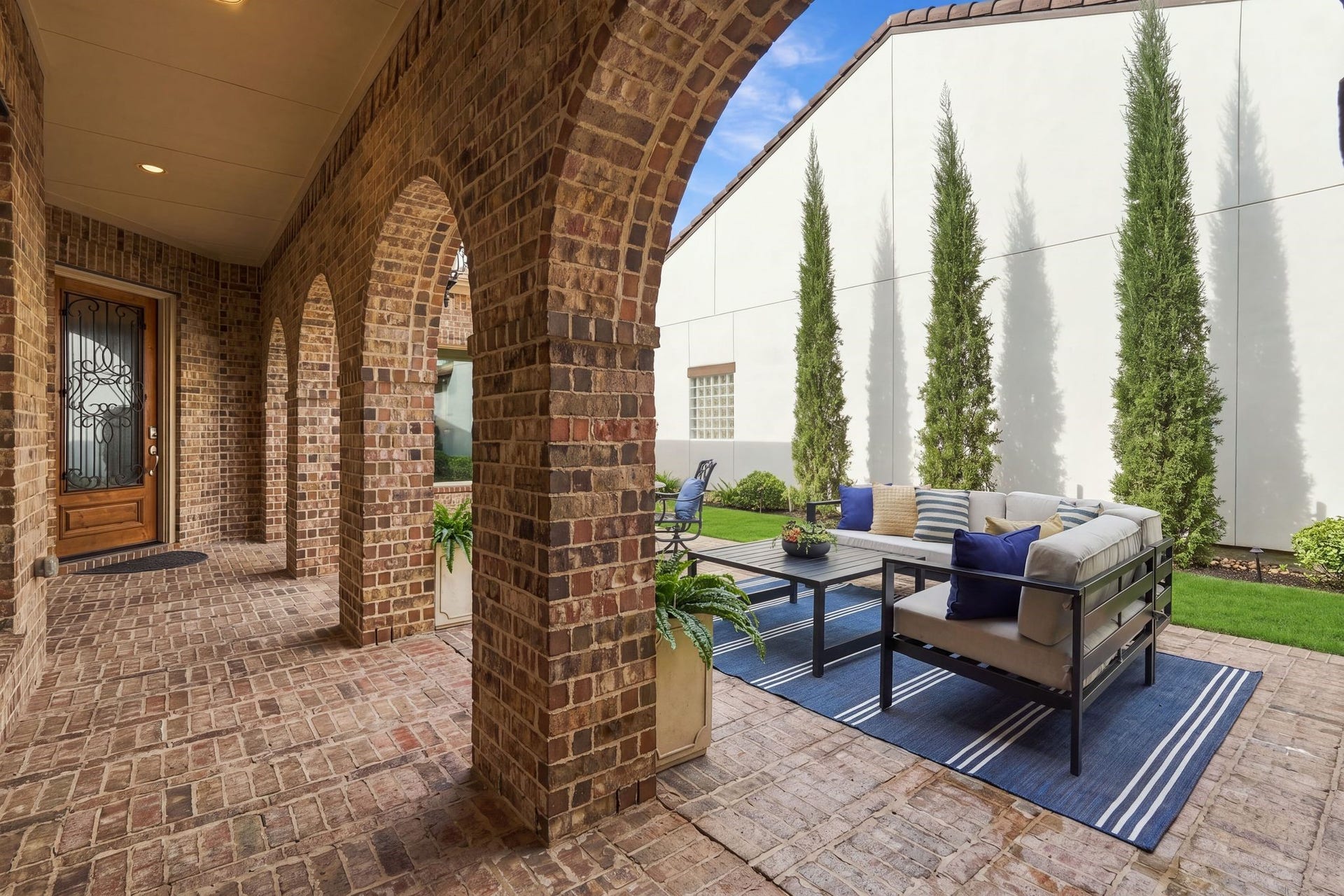 51 Woodglade Way, The Woodlands, TX 77375 Brick lined courtyard on the way to the main entrance offers another area for entertaining and relaxing.