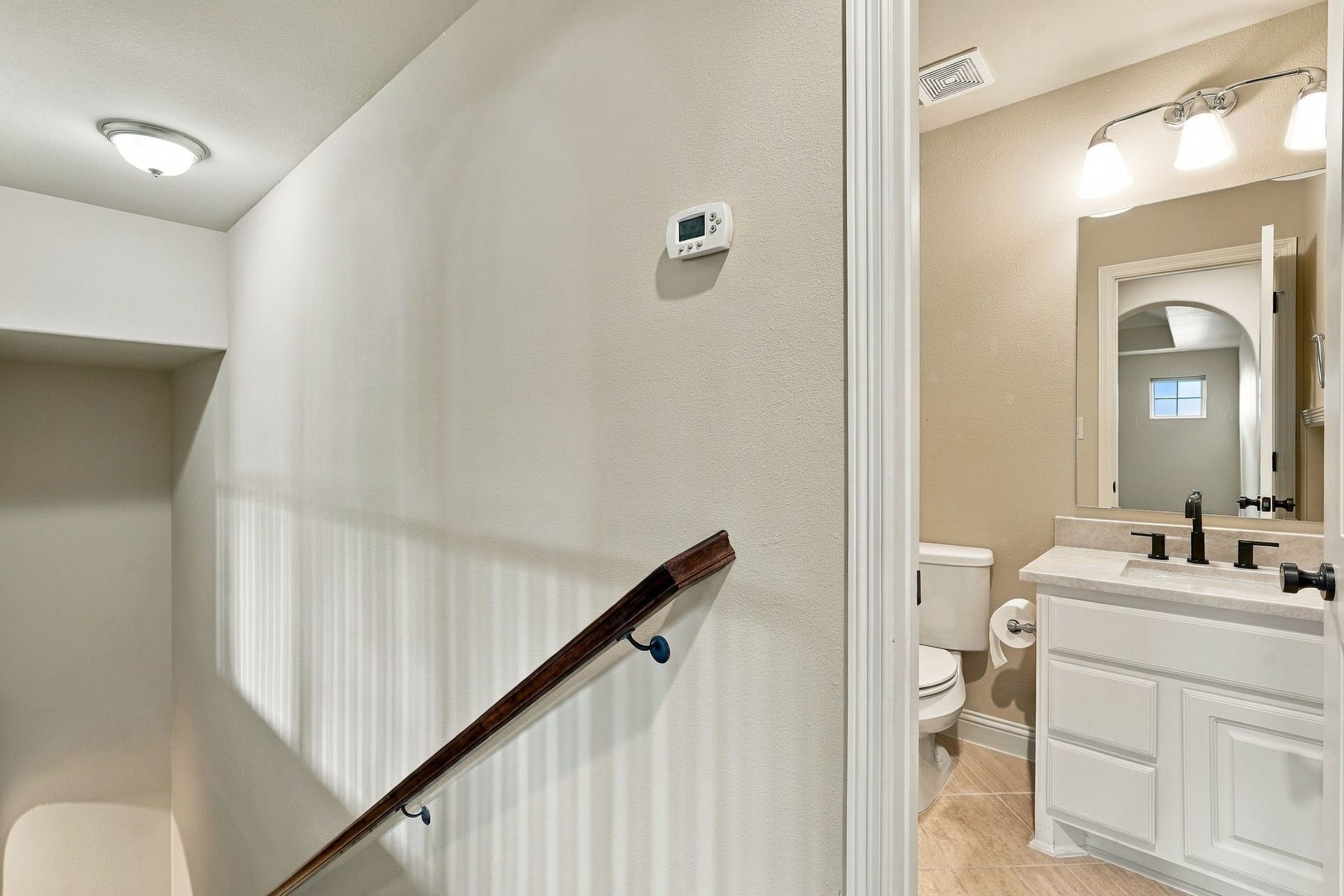 51 Woodglade Way, The Woodlands, TX 77375 The half bathroom on the second level. This also has a large walk in storage area beyond the walls.