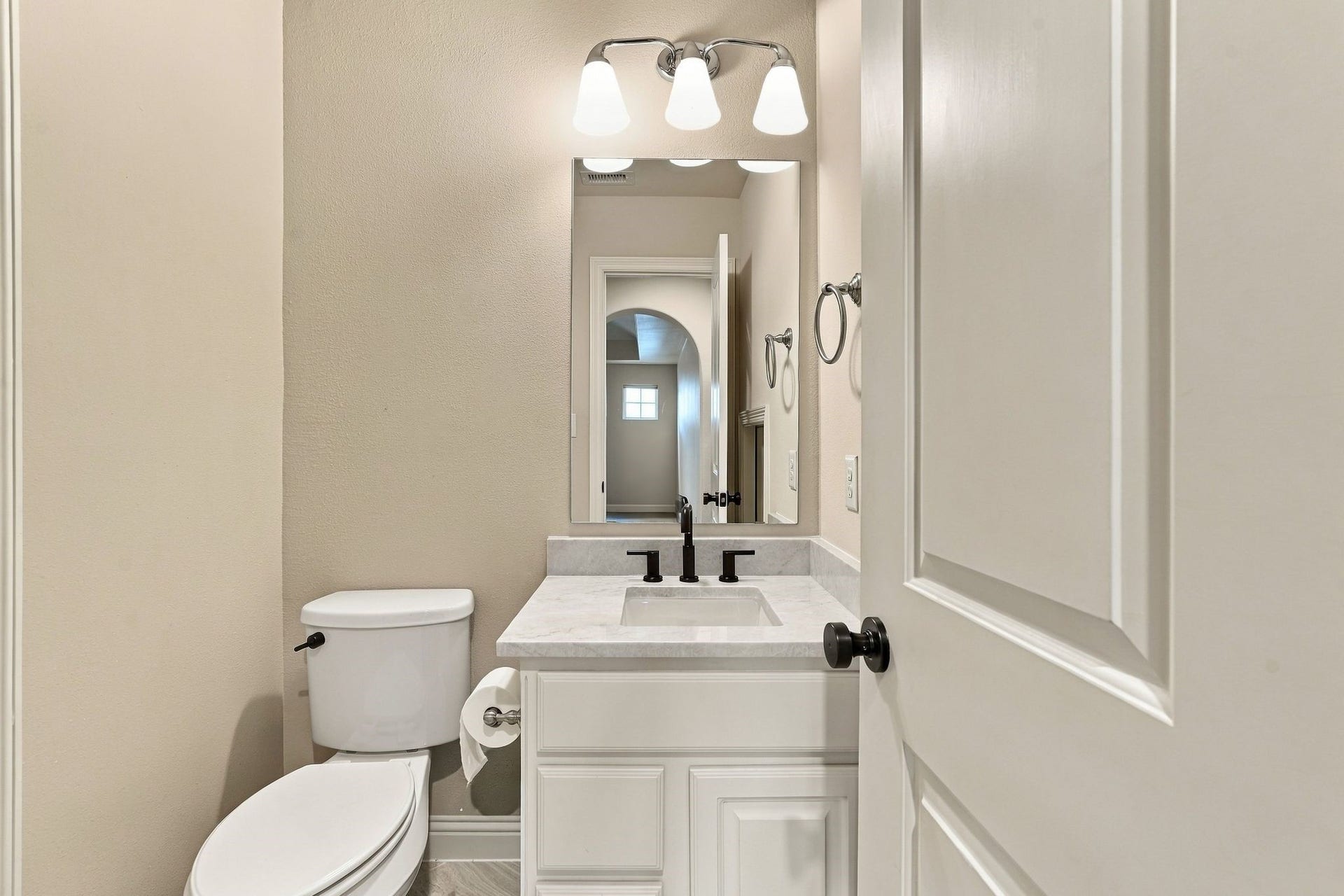 51 Woodglade Way, The Woodlands, TX 77375 Half bathroom. To the left is the additional storage area.