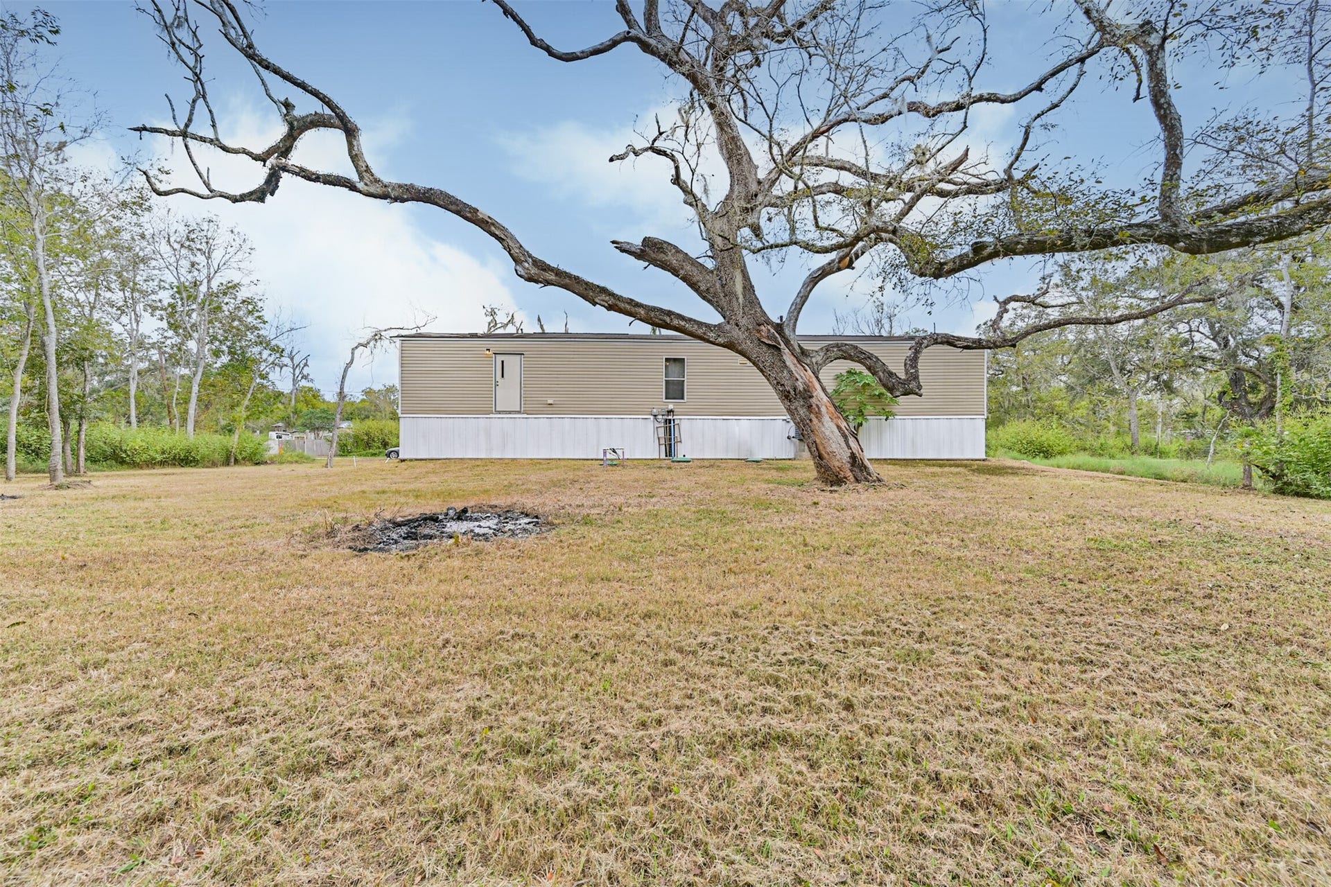 215 Sitka Drive, Holiday Lakes, TX 77515 Plenty of room for a garden or chicken coop or both.