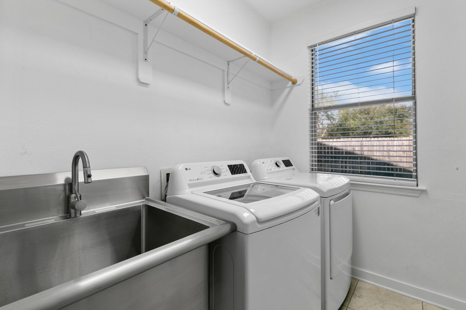 1931 Timber Creek Drive, Missouri City, TX 77459 Laundry room with large sink.