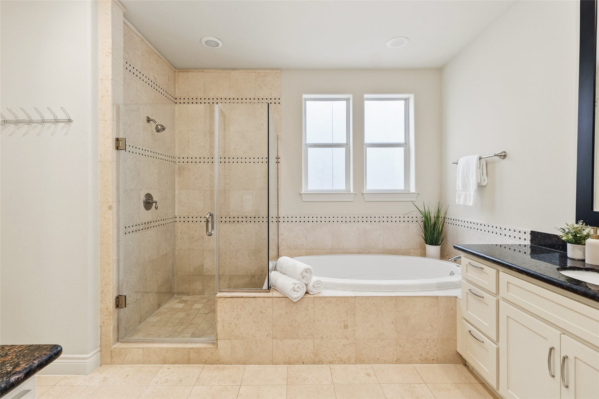 2823 Sherwin Street, Houston, TX 77007 You can unwind in a deep soaking tub or step into the separate glass showerboth finished with clean tile and a spa-like feel. Its your own private space to reset without ever leaving home.