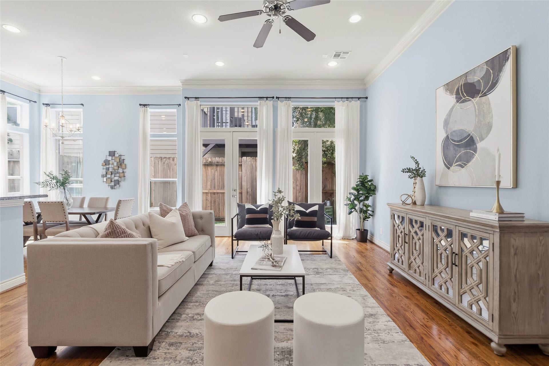 2823 Sherwin Street, Houston, TX 77007 You settle into your living room where the layout naturally centers around conversation and comfort, with tall windows and doors bringing in that soft, everyday light. Its the space youll keep coming back to. Wall paint color has been virtually altered.
