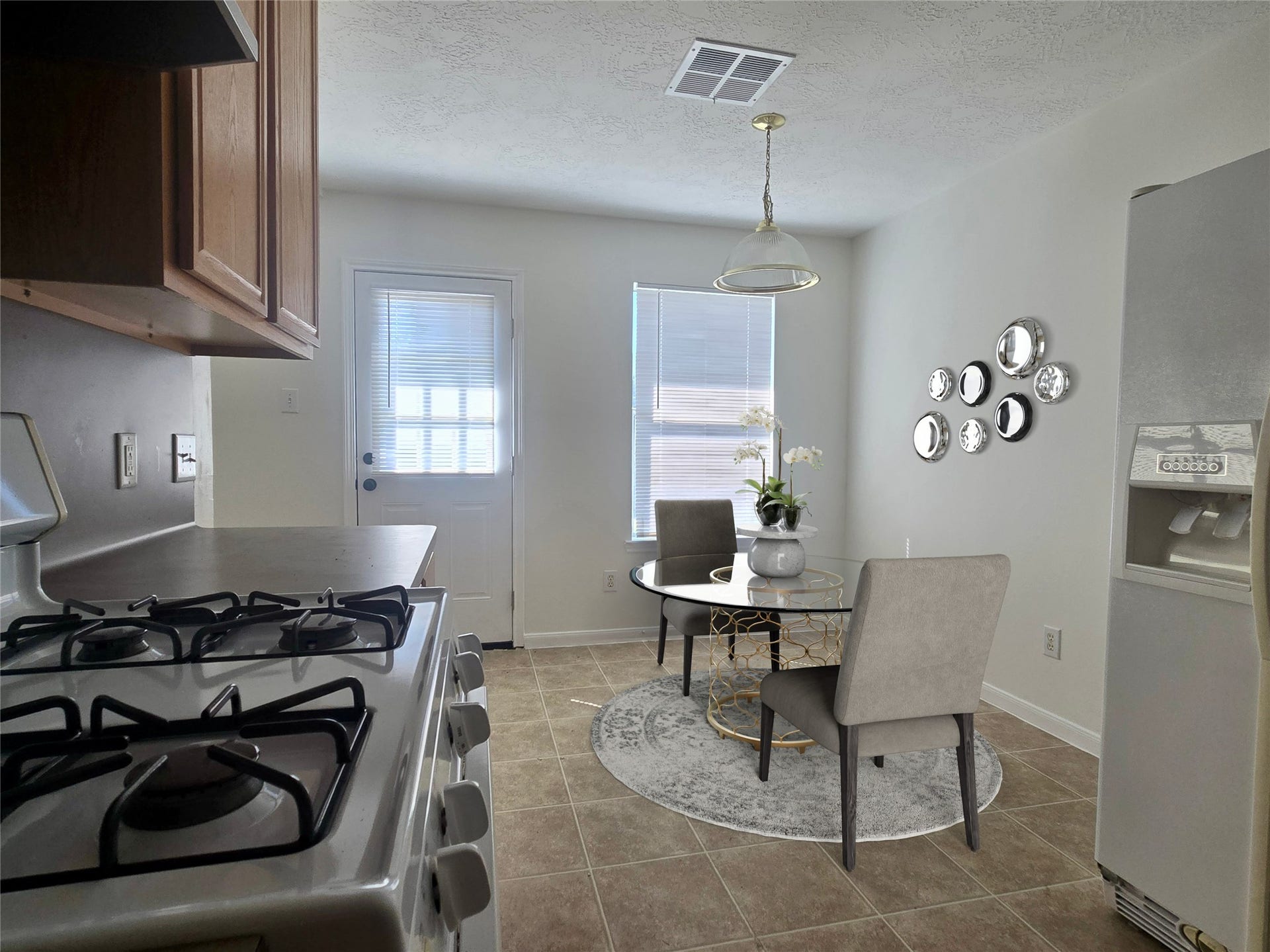 32223 Decker Oaks Drive, Pinehurst, TX 77362 Have your morning coffee or all of your meals in the sunny breakfast area. (Virtuallly staged)