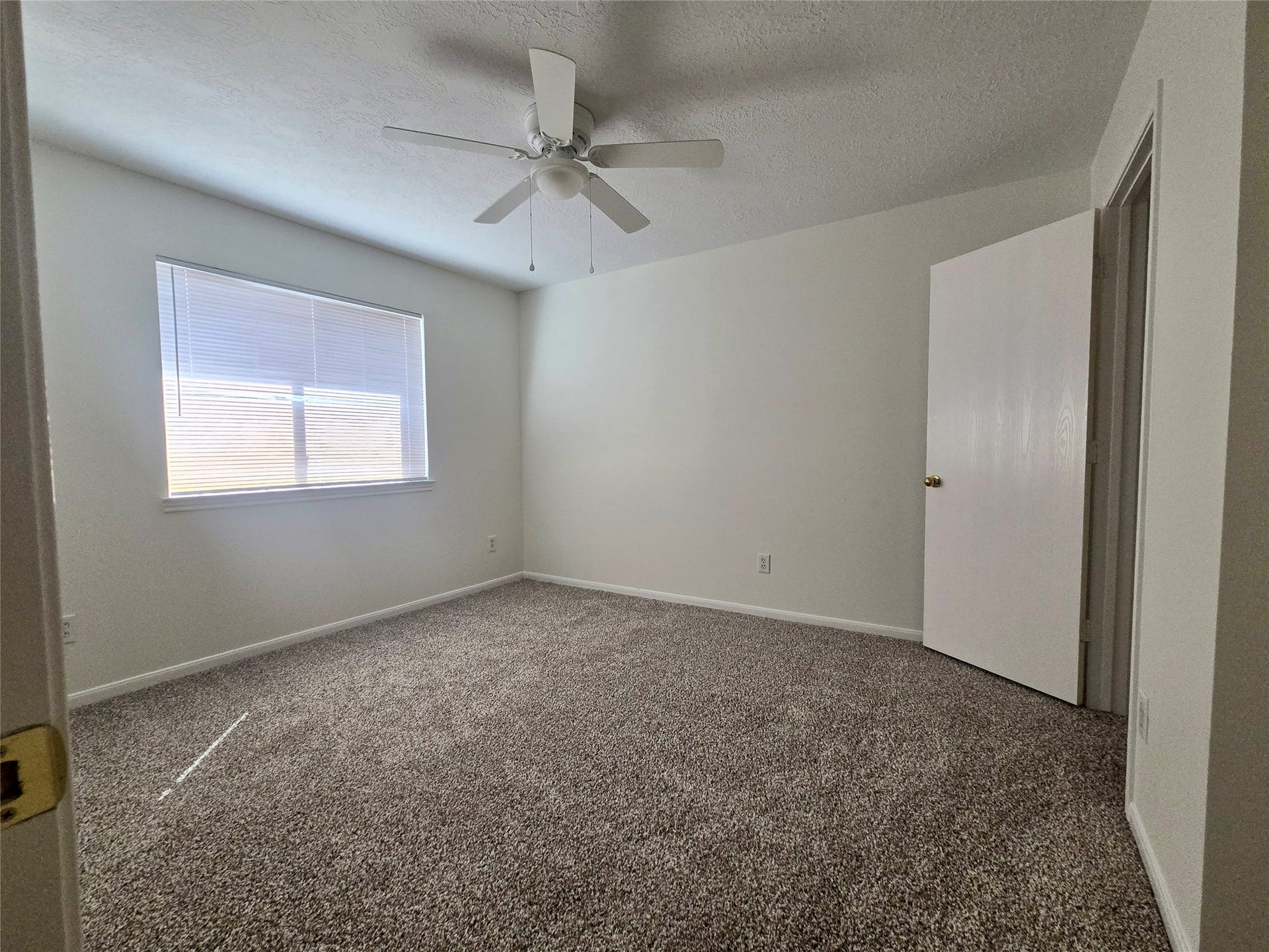 32223 Decker Oaks Drive, Pinehurst, TX 77362 Bedroom #3 also has a ceiling fan already in place.