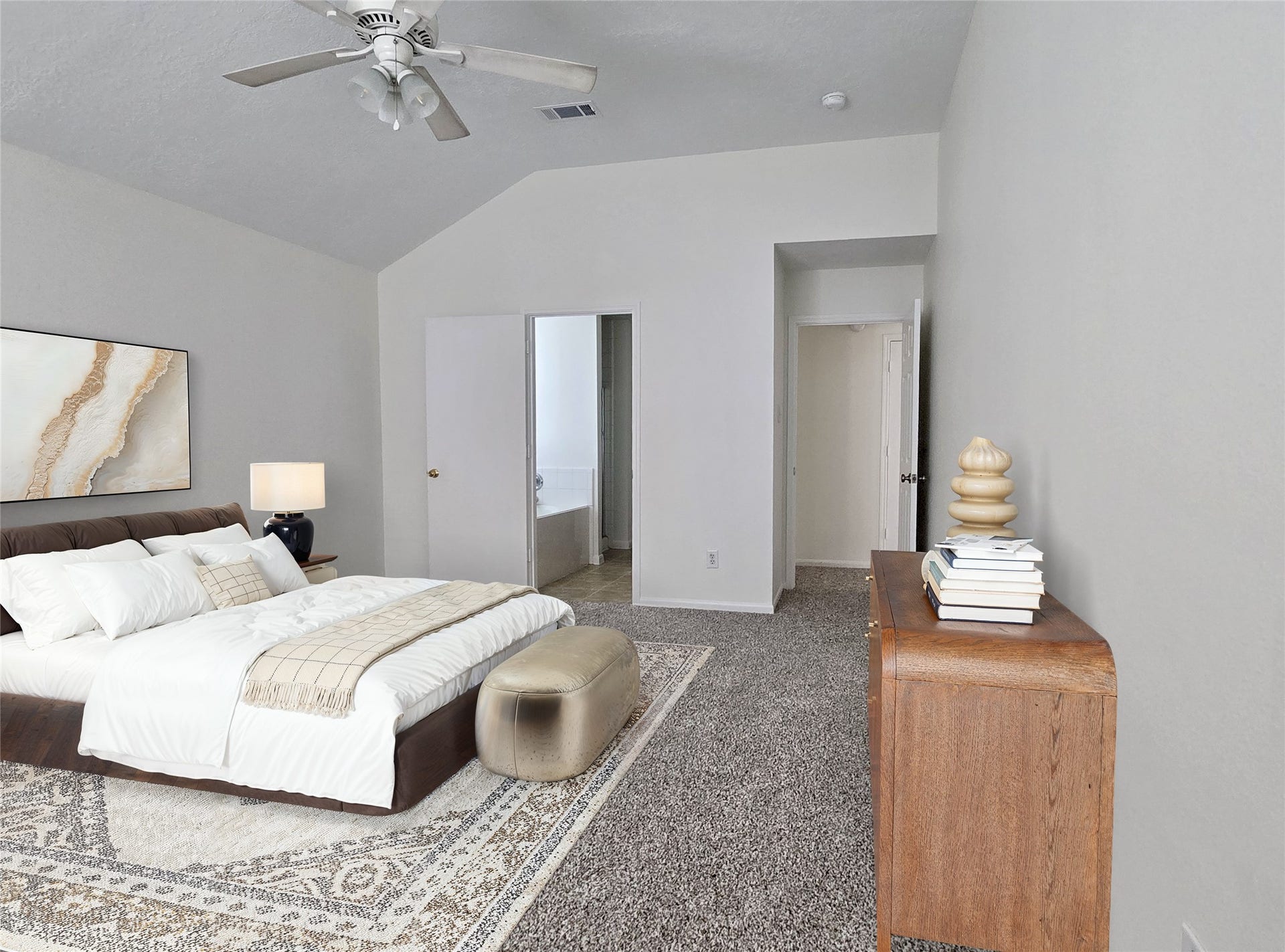 32223 Decker Oaks Drive, Pinehurst, TX 77362 The primary suite feels private with the split layout, and extra spacious with the raised ceiling detail. Noticing a ceiling fan. (Virtually staged)