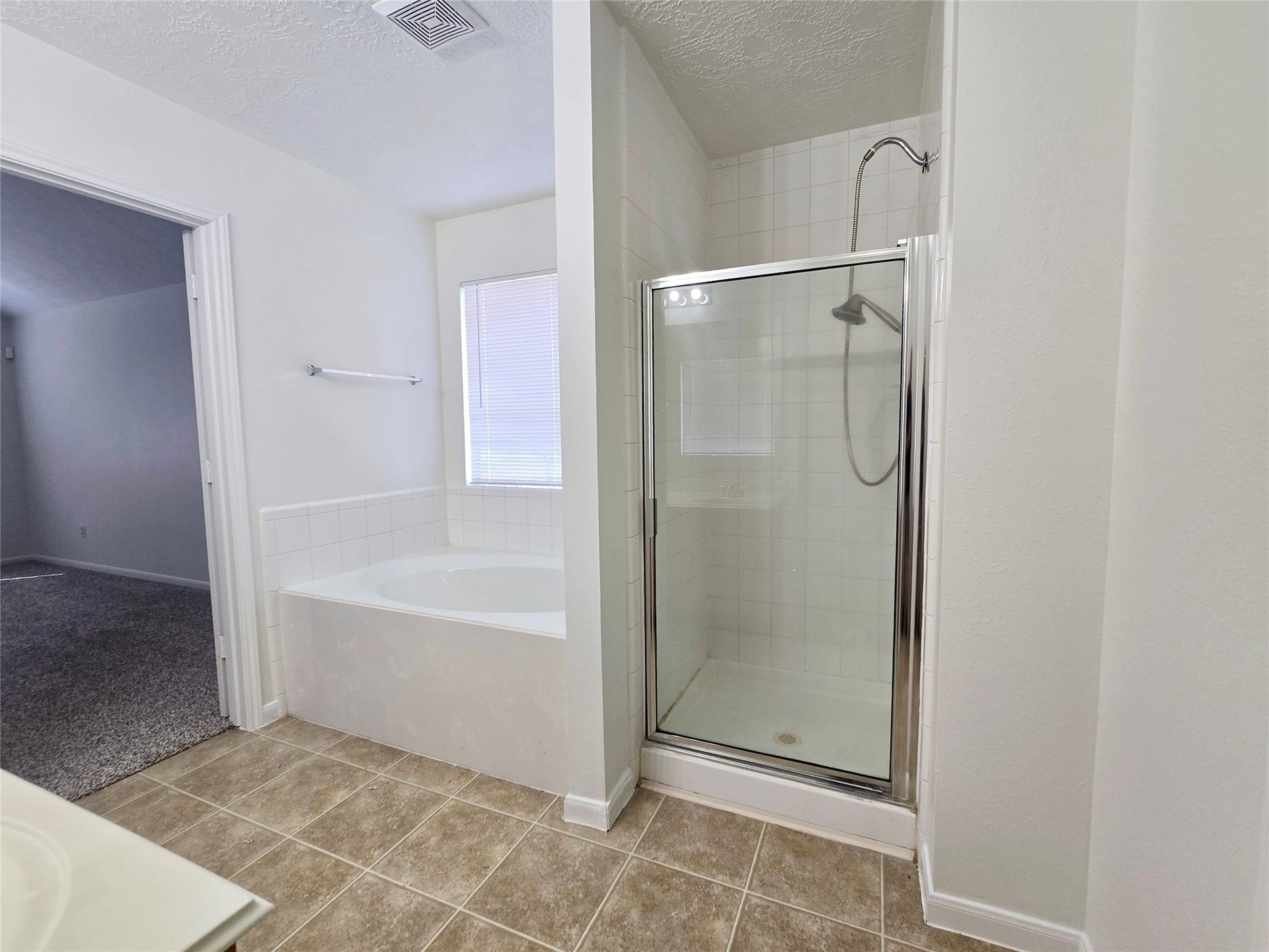 32223 Decker Oaks Drive, Pinehurst, TX 77362 Enjoy a soak in the garden tub, or just a quick shower - you have the choice in this primary bath.