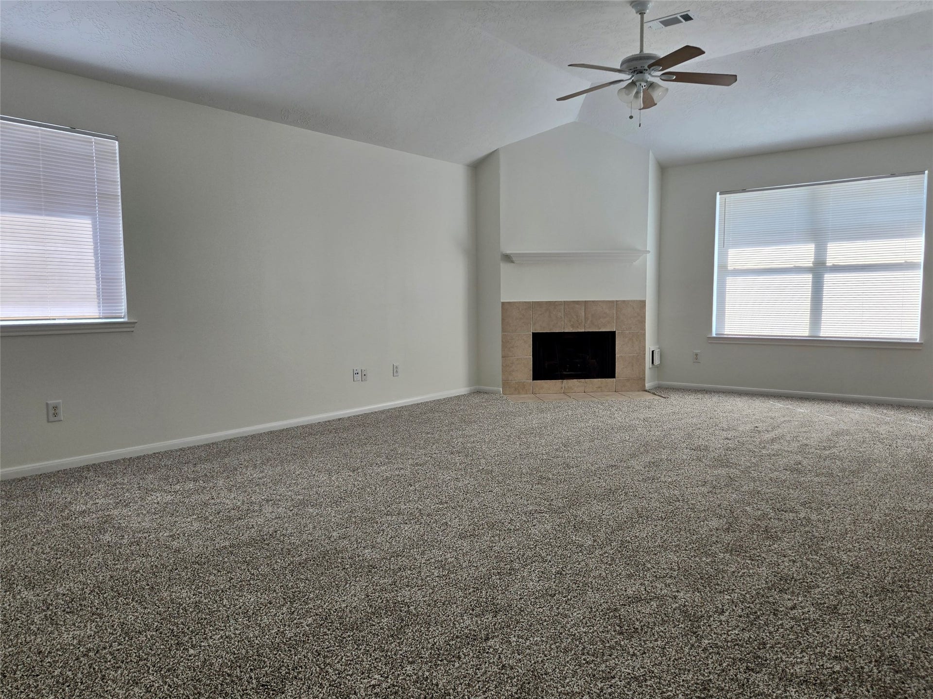 32223 Decker Oaks Drive, Pinehurst, TX 77362 Youre open concept living room and formal dining room are one continuous and very large space.