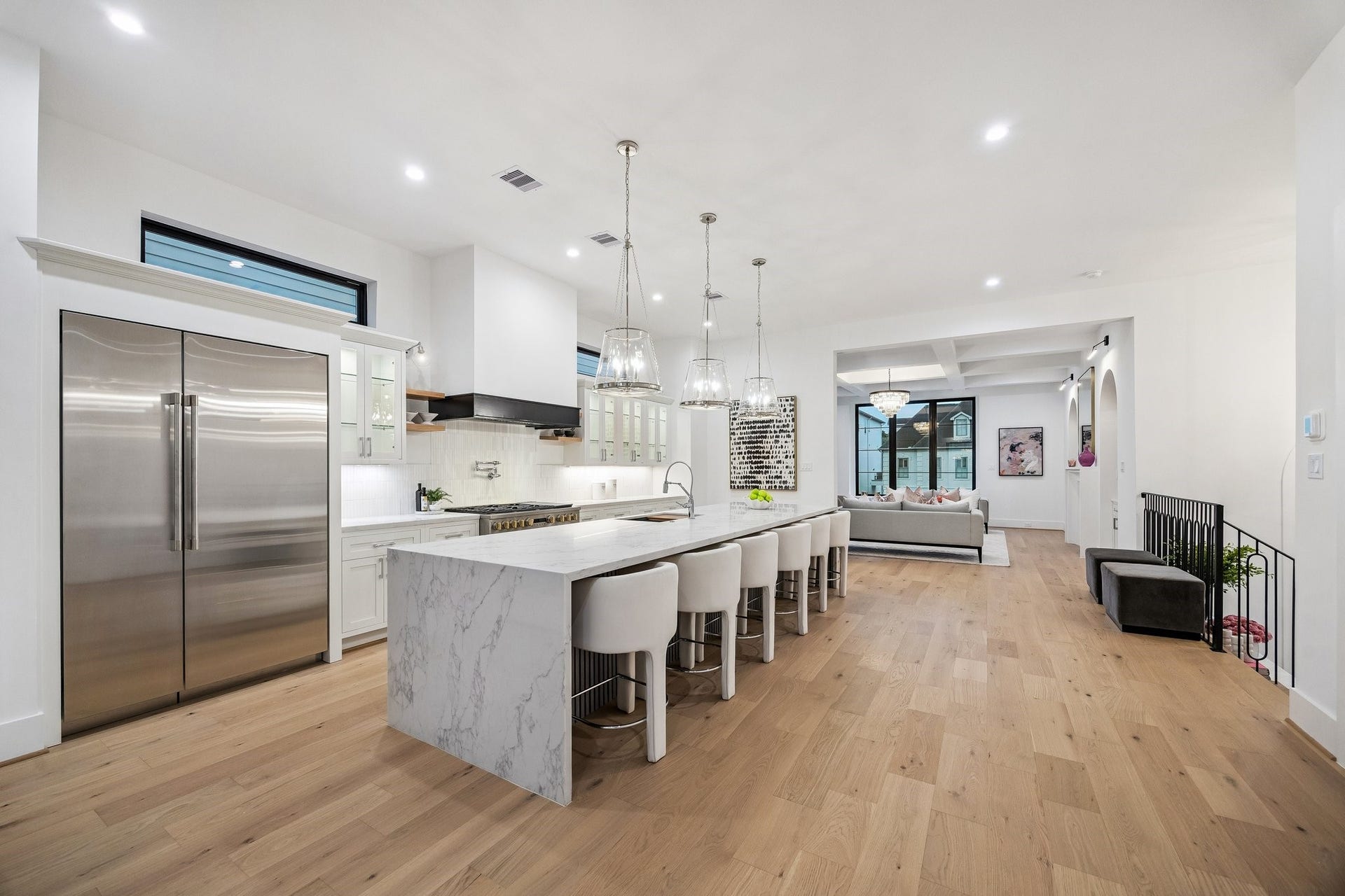 Great, open expansive space. Large Island with Breakfast Bar Seating for Six and Acoustic Slat Wood Panel Front.