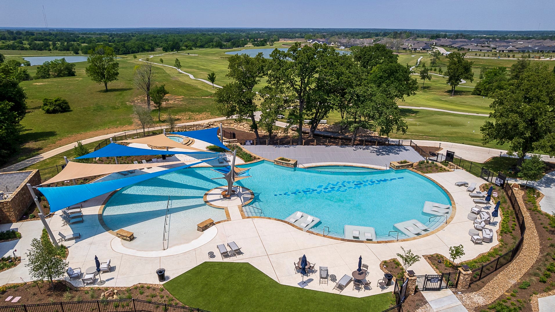 Relax and recharge at the brand-new resort-style pool at Chambers Creekexclusively designed for active adult living, with shaded areas and plenty of space to unwind in style.