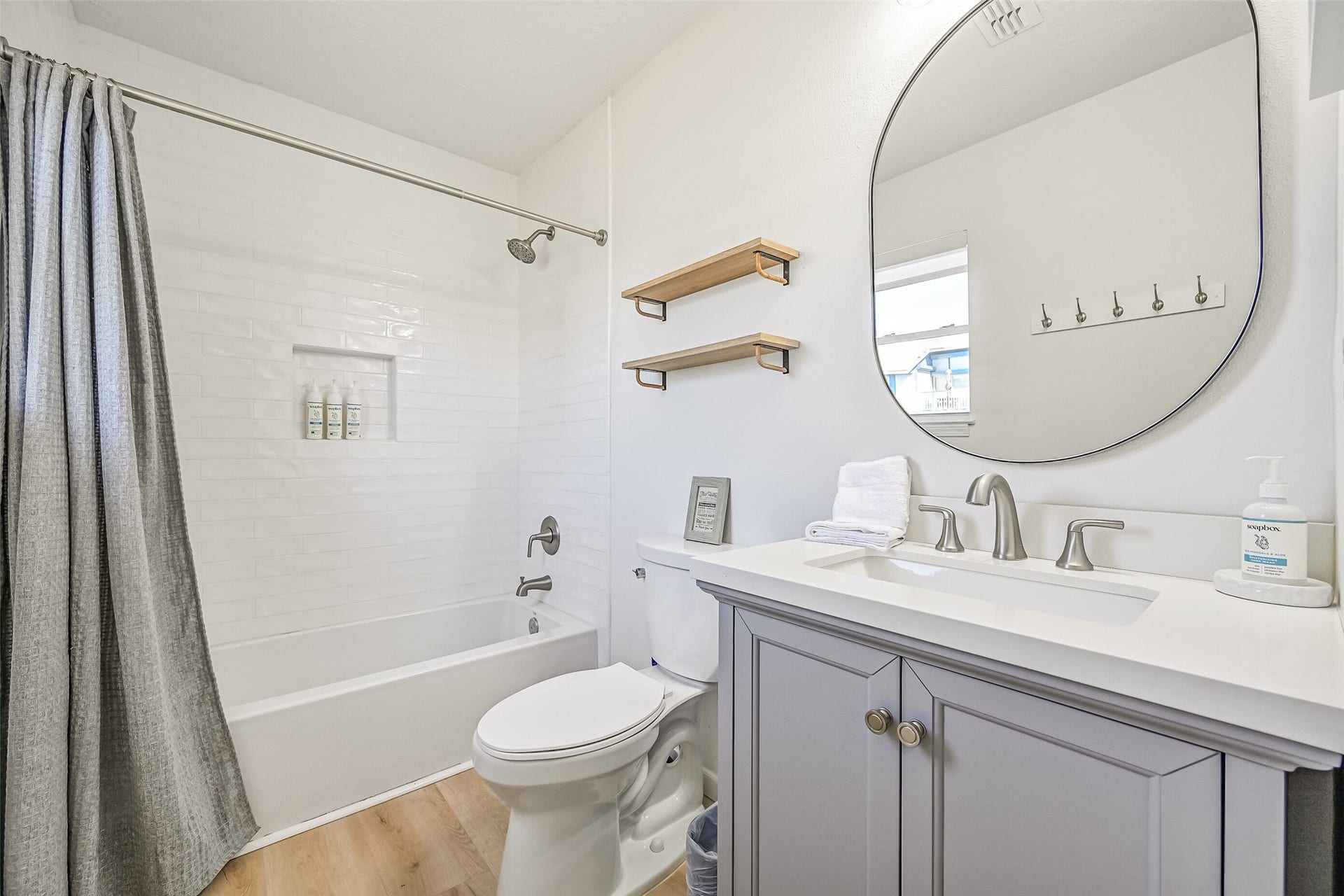 17620 Glei, Galveston, TX 77554 The renovated primary bathroom features a tub and shower combination.