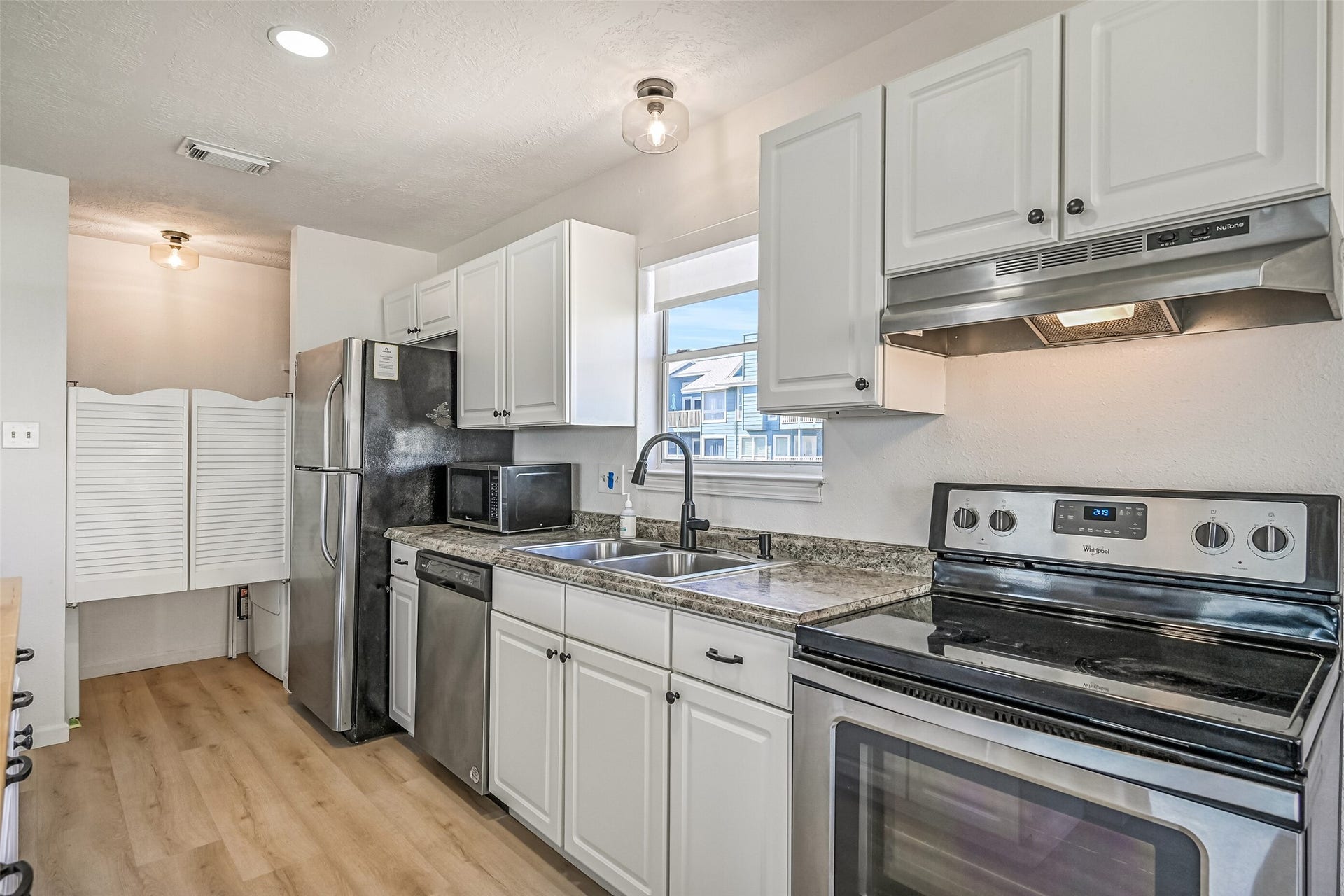 17620 Glei, Galveston, TX 77554 Through the doors ahead you will find the washer and dryer.