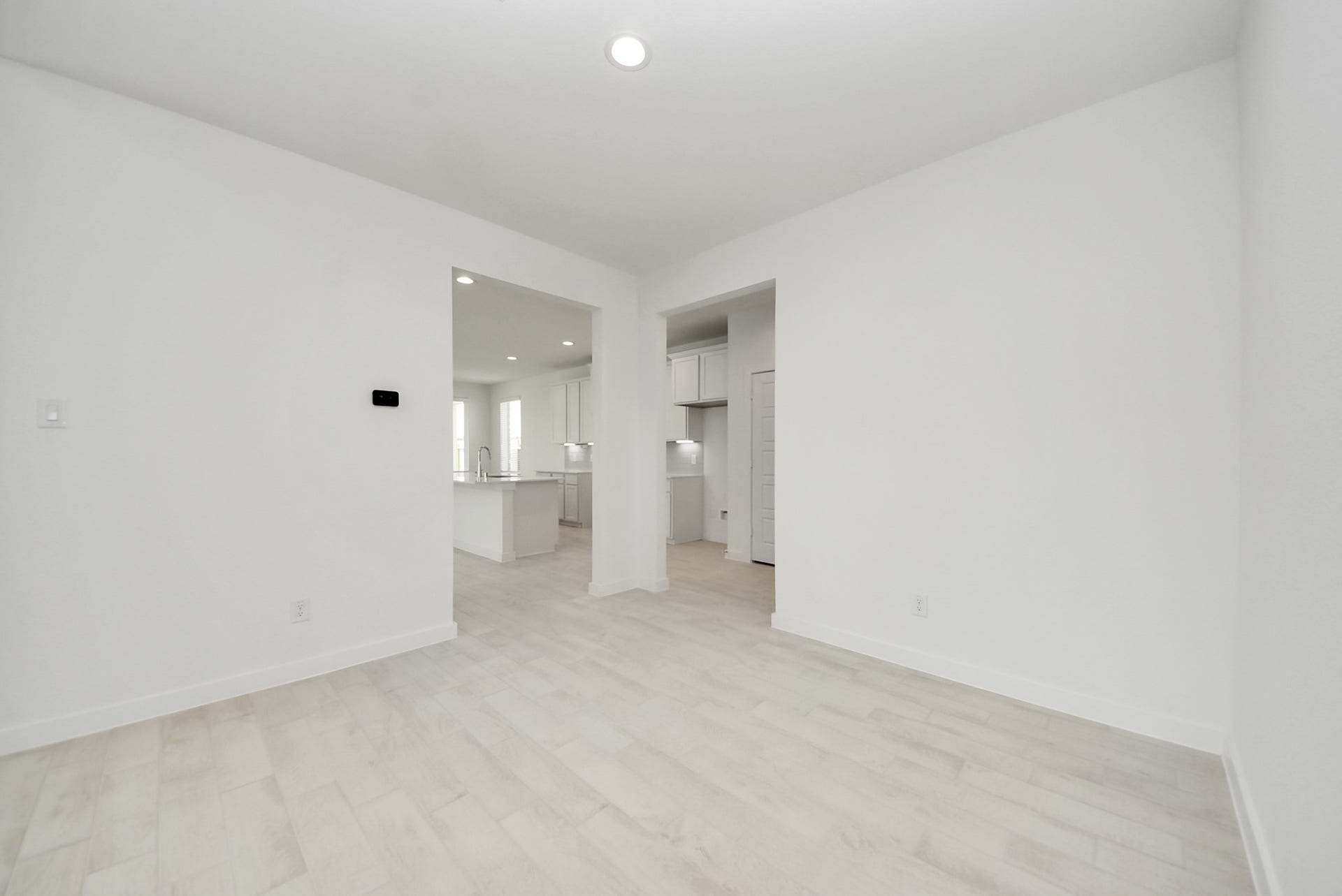 Make memories gathered around the table with your family and friends! This spacious dining room features elegant flooring, custom paint, and adjacent to family room and kitchen for open concept feel.