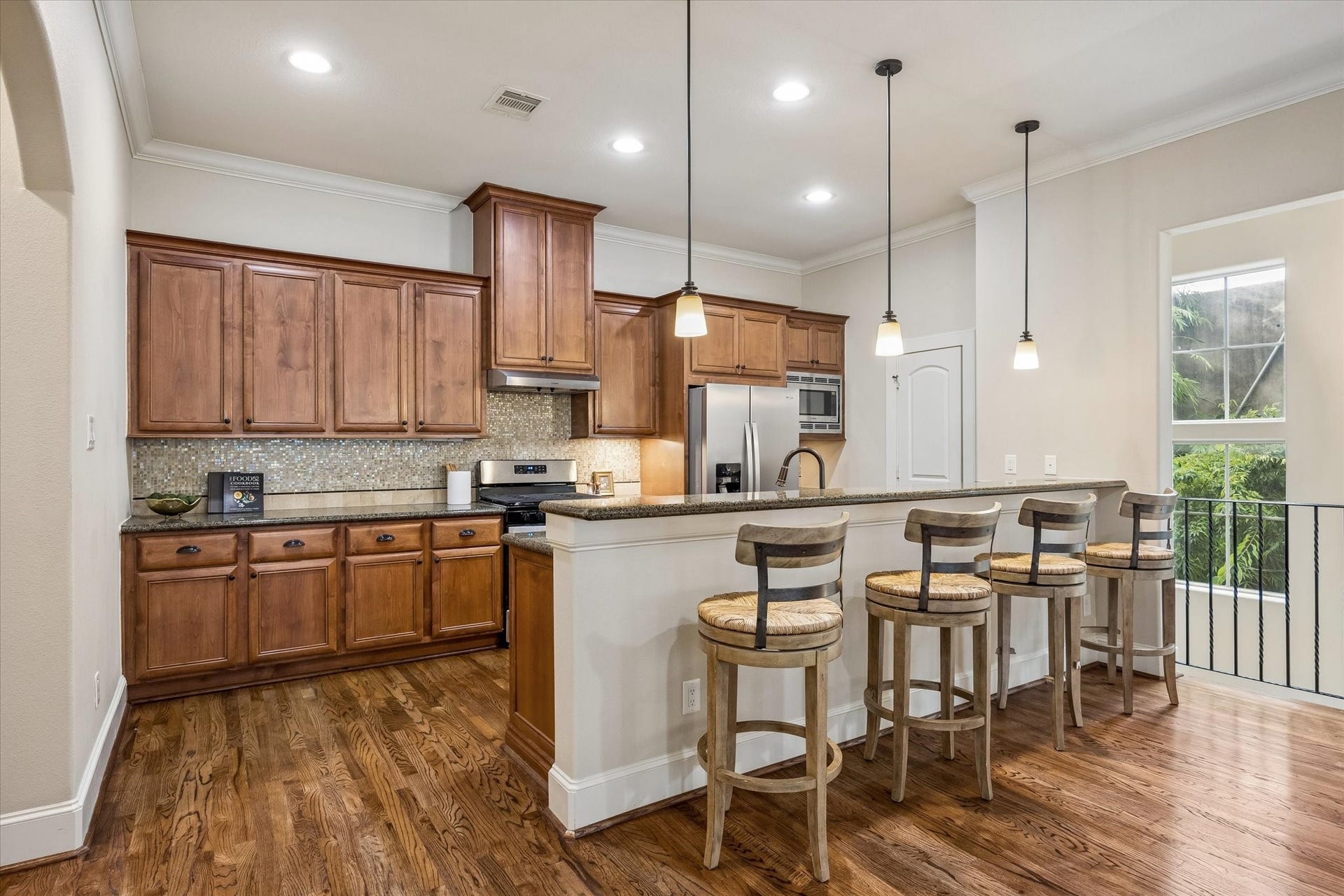 1112 Peveto Street, #C, Houston, TX 77019 The kitchen offers new appliances, granite countertops, a breakfast bar and walk-in pantry.