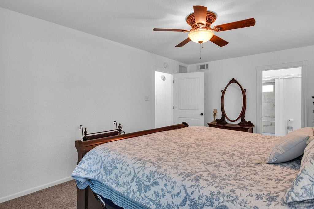 131 Frostwood Drive, Lake Jackson, TX 77566 Primary bedroom with entrance to the en suite