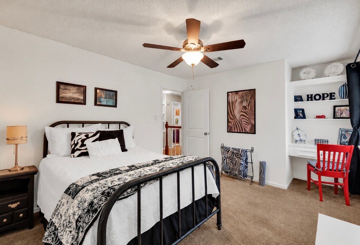 131 Frostwood Drive, Lake Jackson, TX 77566 The "black and red" secondary bedroom