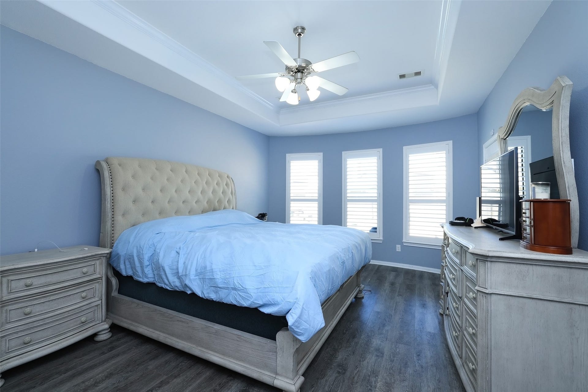 20811 Noble Crusade Court, Tomball, TX 77375 Oversized master bedroom with upgraded flooring, and a door leading to the patio area