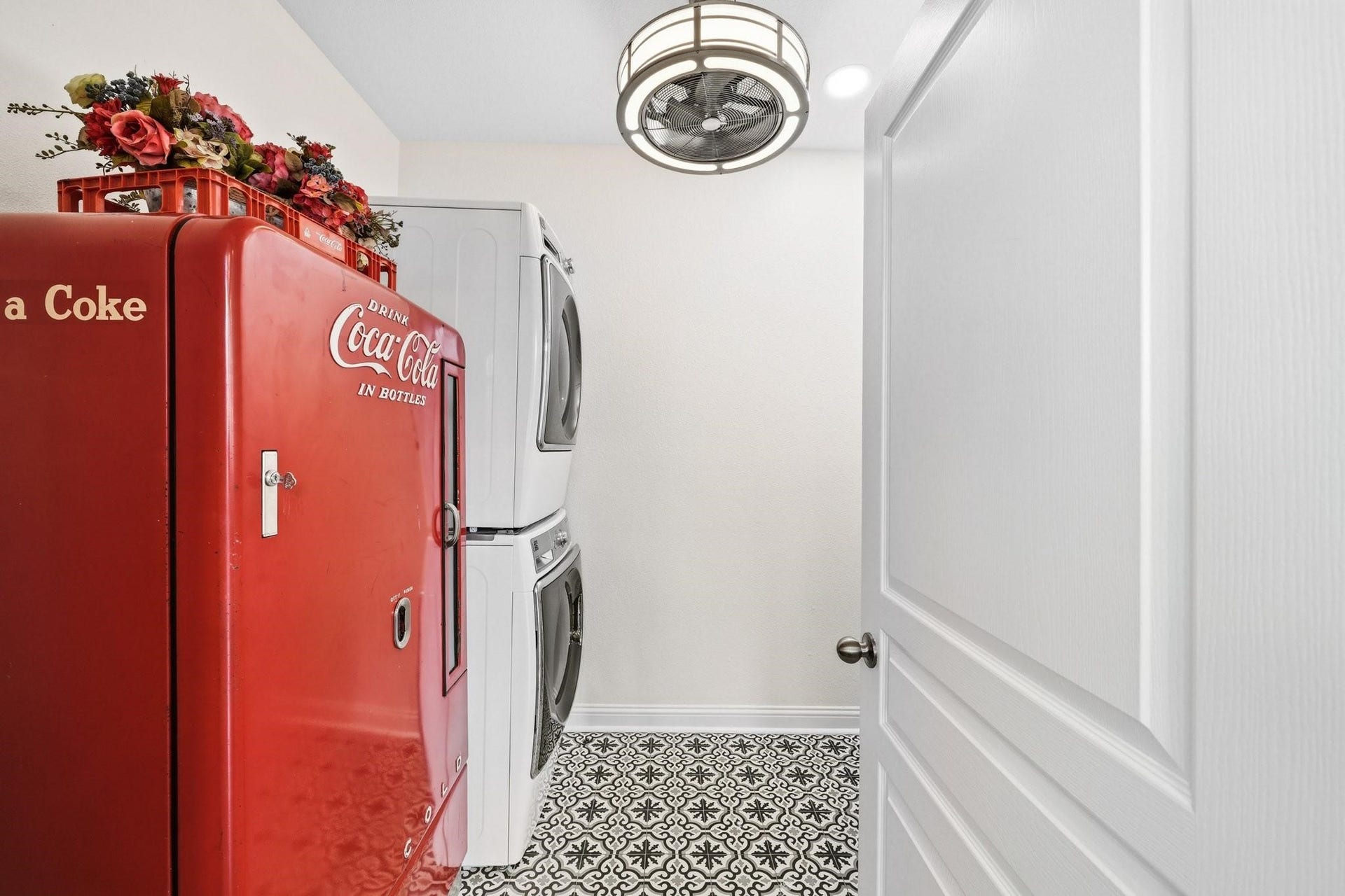 17610 Strackfield Lane, Tomball, TX 77377 The spacious utility room combines style and function with decorative tile flooring, abundant built-in cabinetry, and a full-size Kenmore front-load washer and dryer.