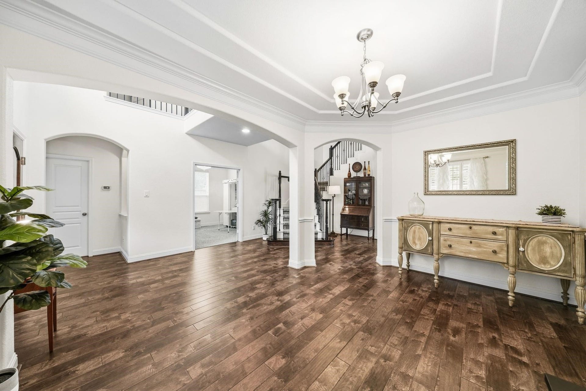 17610 Strackfield Lane, Tomball, TX 77377 Just to the left is a wall of windows dressed in plantation shutters which brighten the room and offers a welcoming connection to the front porch.