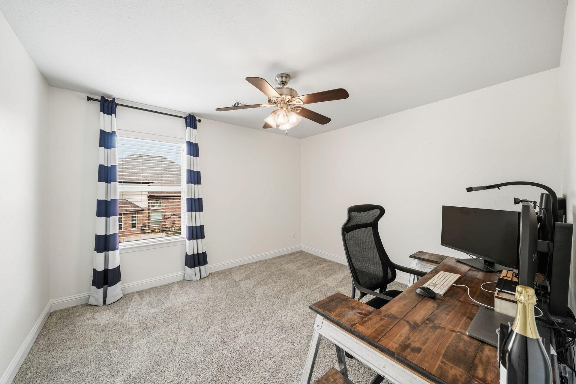 17610 Strackfield Lane, Tomball, TX 77377 Tucked discreetly beyond the fourth bedroom closet, this versatile bonus room feels like a private sanctuary, complete with soft carpet, a sunlit window, and a ceiling fan for year-round comfort.