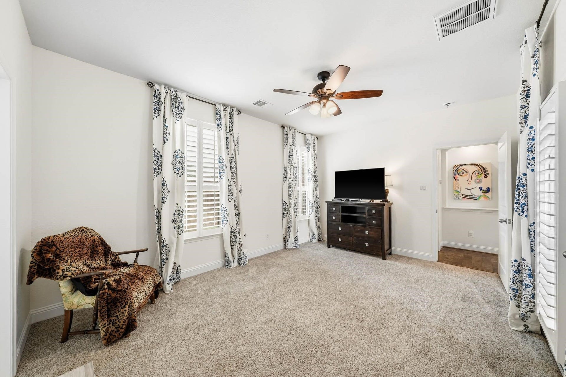 17610 Strackfield Lane, Tomball, TX 77377 Positioned privately at the front of the home, this secondary bedroom creates a suite-like experience where guests can relax and unwind in complete comfort.