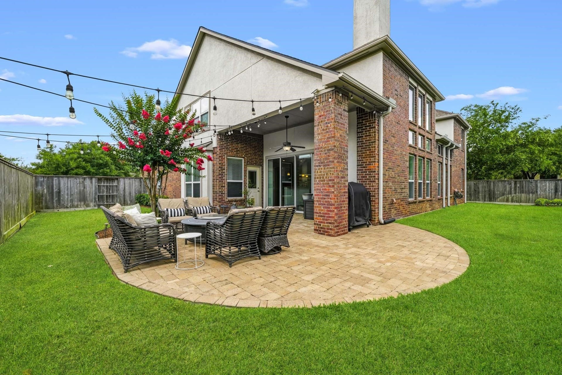 17610 Strackfield Lane, Tomball, TX 77377 Framed by elegant brick columns and enhanced by tall ceilings, this covered patio offers a comfortable and sophisticated setting for morning coffee, evening gatherings, and everything in between.