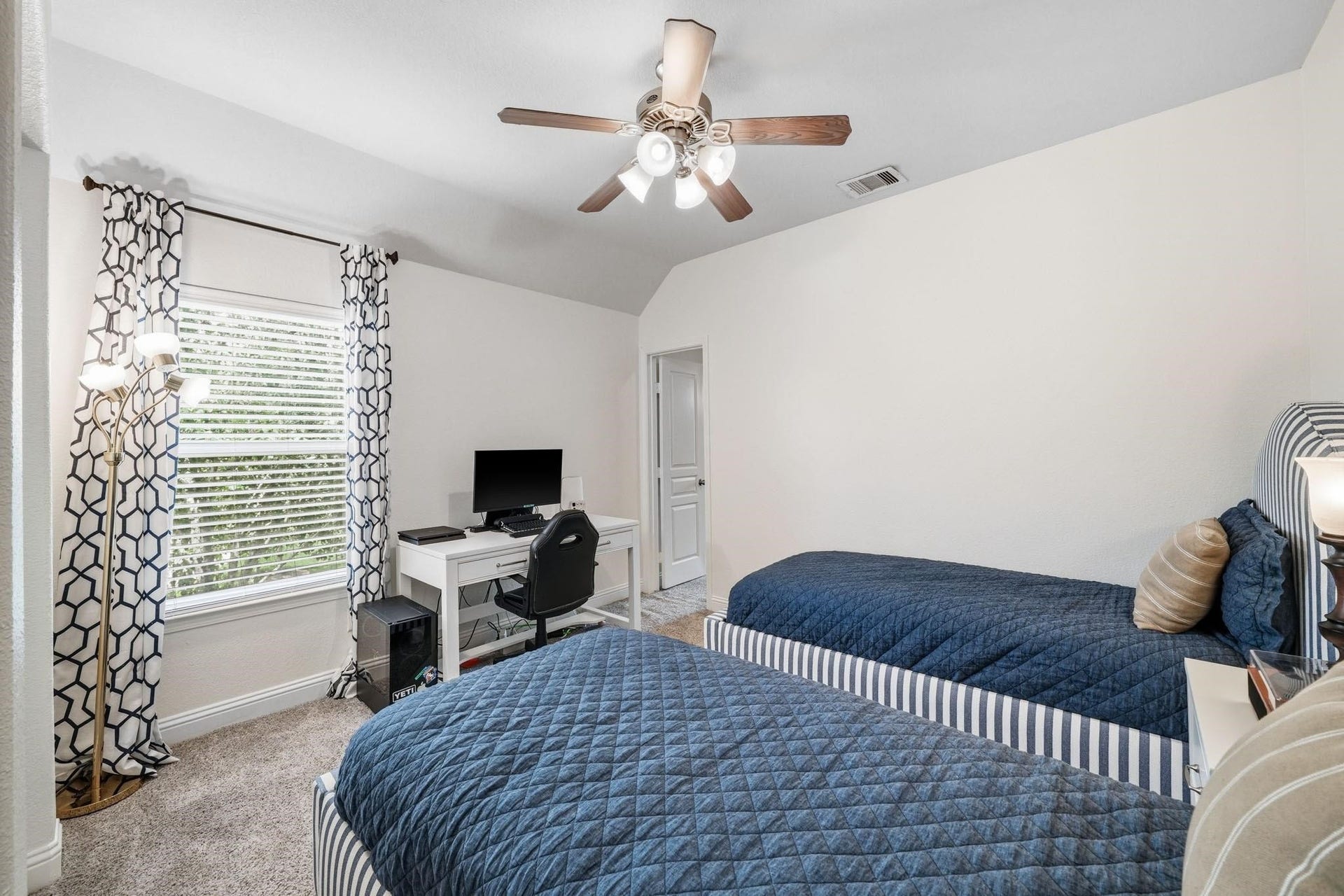 17610 Strackfield Lane, Tomball, TX 77377 Wrapped in comfort and style, the fourth bedroom features a tray ceiling, plush carpeting, and a ceiling fan with integrated light, making it an ideal spot. Through the door on the right is a walk-in closet woth access to a bonus/flex room.