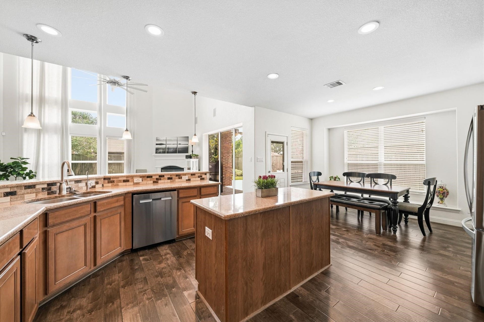 17610 Strackfield Lane, Tomball, TX 77377 The expansive center island with granite countertop serves as the heart of the kitchen, blending style, function and connection.