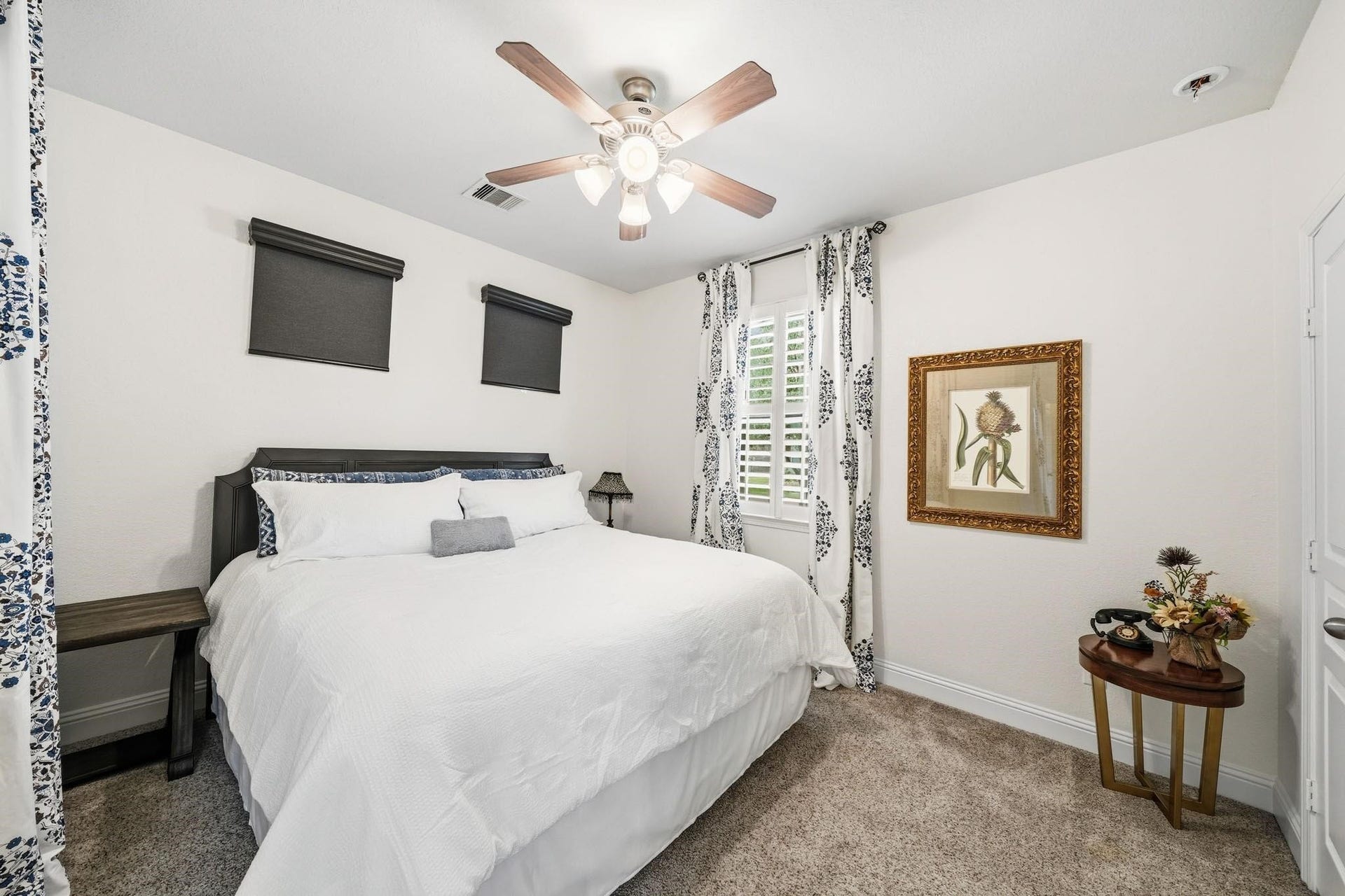 17610 Strackfield Lane, Tomball, TX 77377 The bedroom within the suite has windows with blinds, drapes and a ceiling fan with integrated light, creating a charming retreat for guests or multigenerational living.