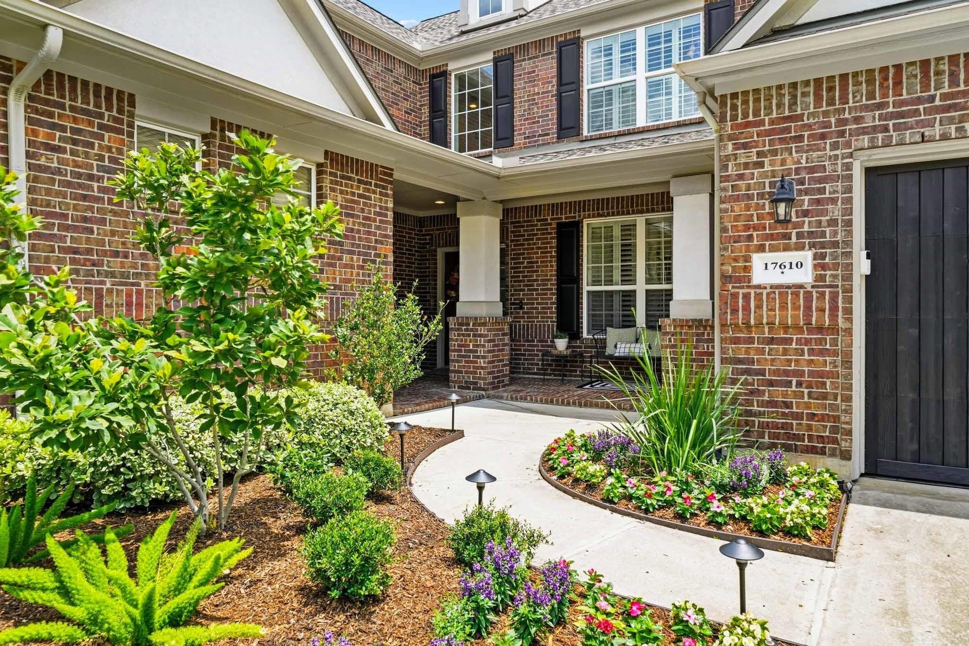 17610 Strackfield Lane, Tomball, TX 77377 Beautifully positioned on a tree-lined corner lot, the home's timeless brick and stucco exterior is complemented by manicured grounds and professionally installed landscape lighting.