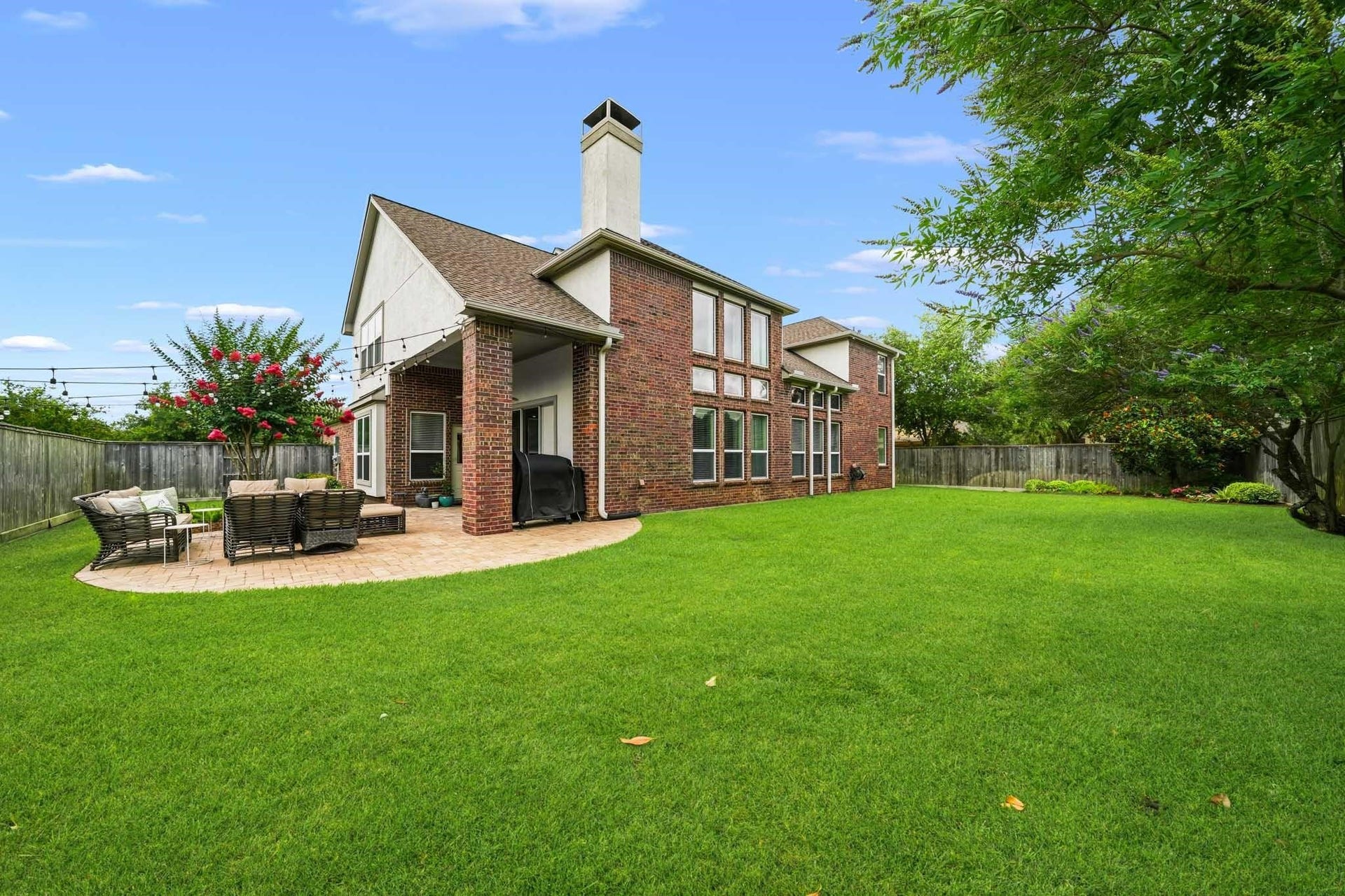 17610 Strackfield Lane, Tomball, TX 77377 Vibrant landscaping, mature trees, and expansive green space transform the backyard into a secluded space where beauty, privacy and Texas outdoor living come together effortlessly.