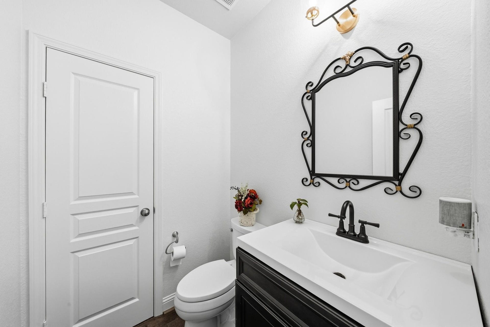 17610 Strackfield Lane, Tomball, TX 77377 Designer finishes elevate this stylish powder room, where a furniture-style vanity, statement mirror, and curated lighting create a sophisticated guest experience.